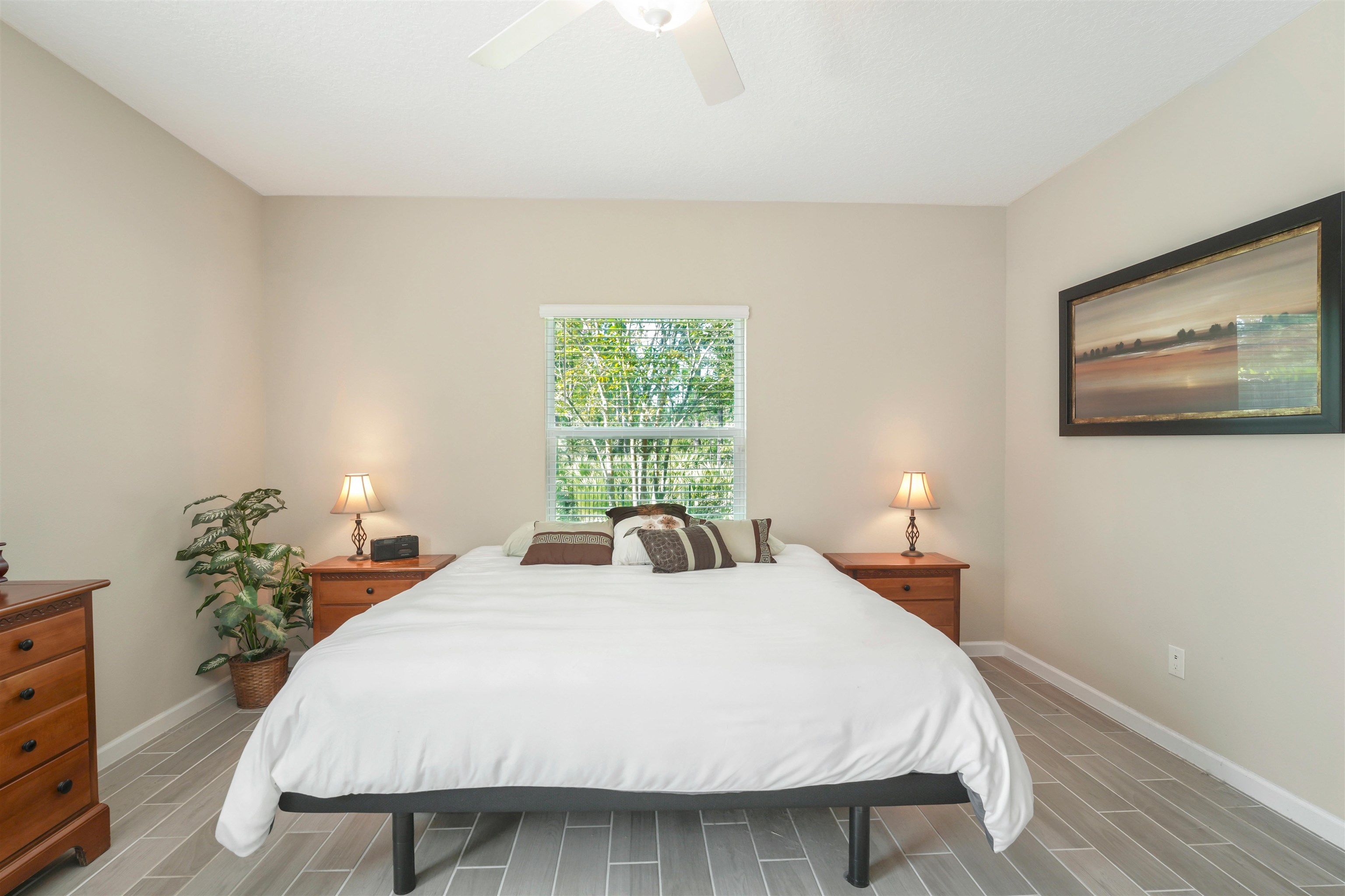 503 Stone Arbor Lane St. Augustine, FL 32086 - Photo 23 of 44 a bedroom with a bed and lamp with window