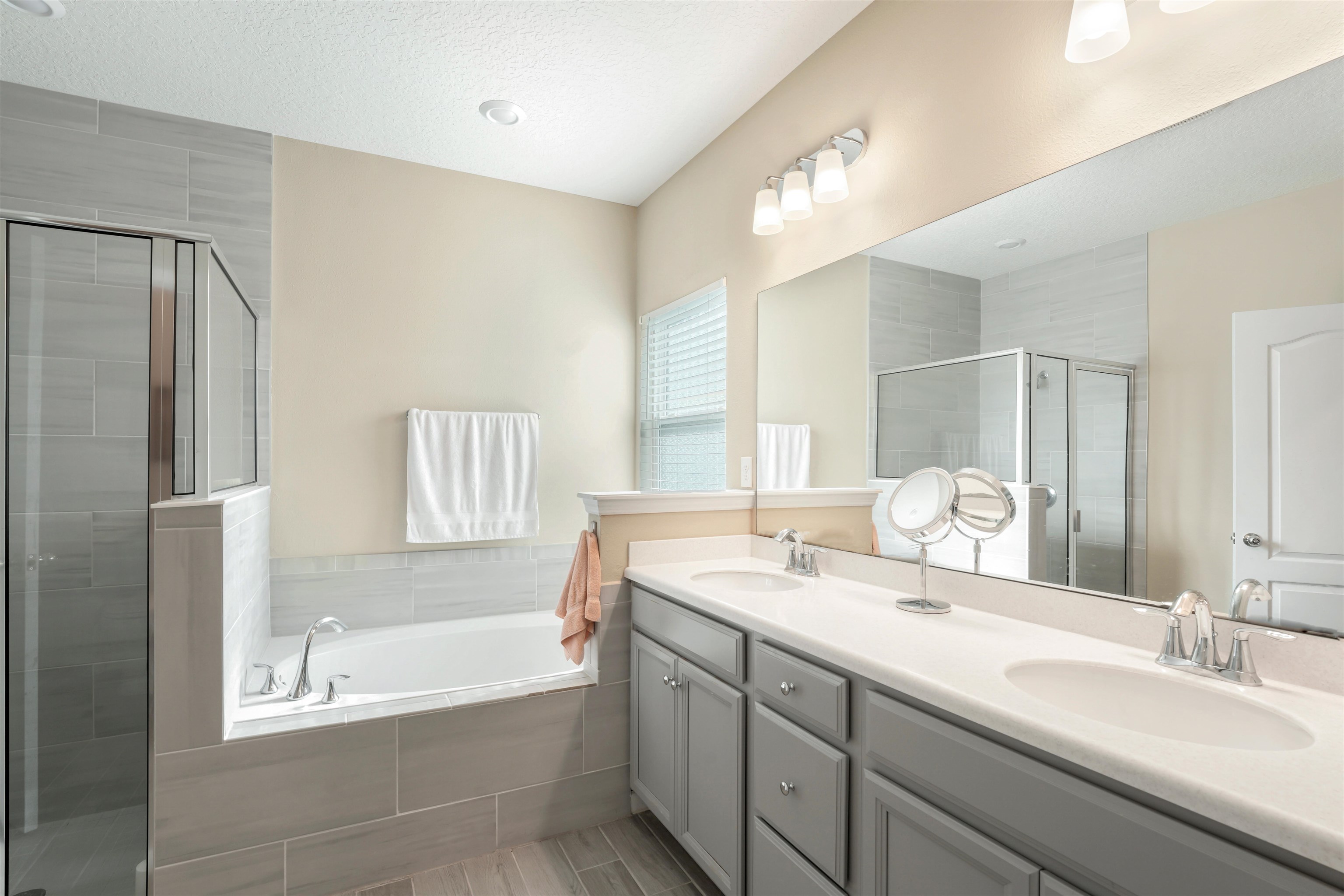 503 Stone Arbor Lane St. Augustine, FL 32086 - Photo 25 of 44 a bathroom with a tub sink and a mirror