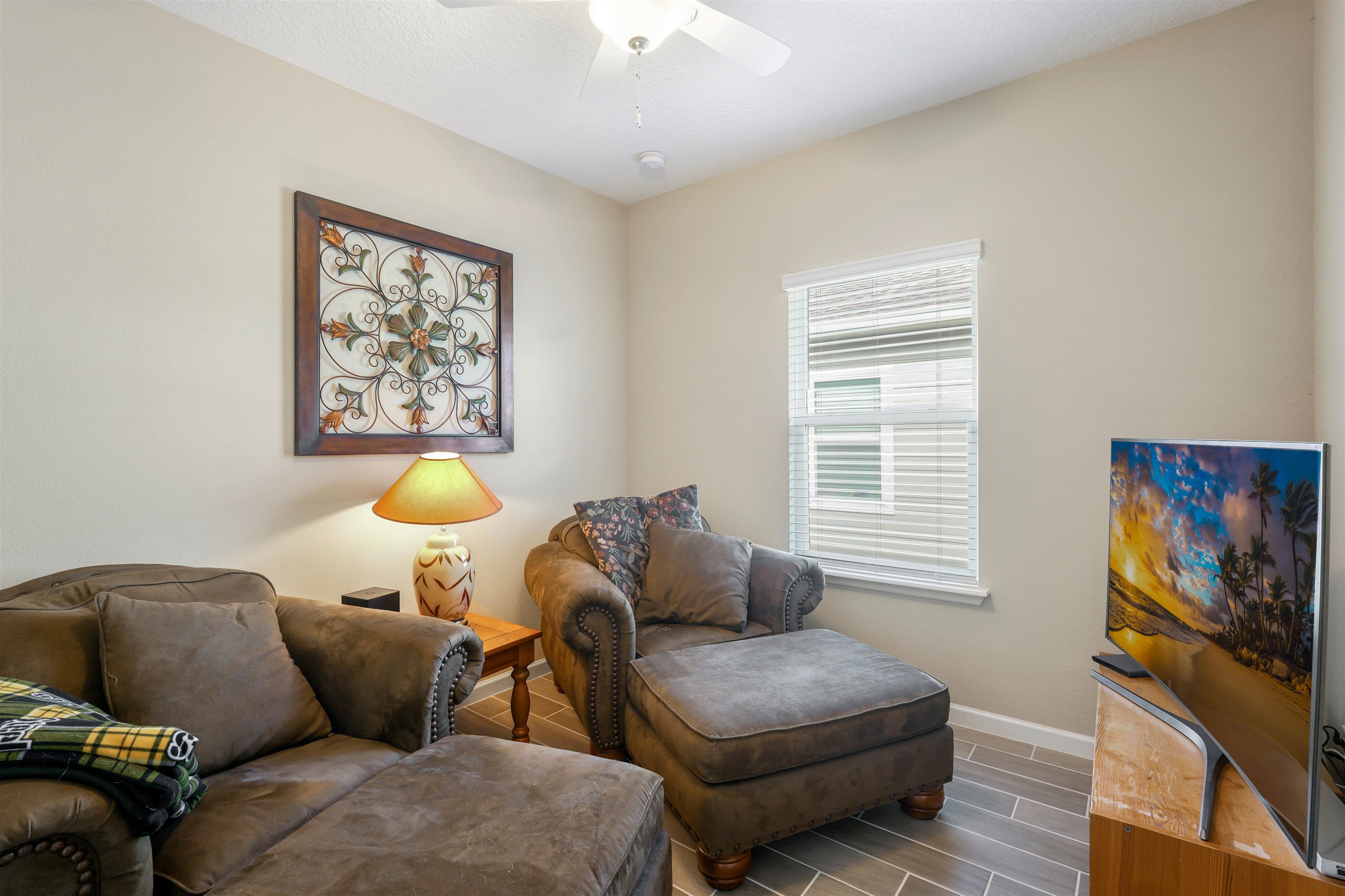 503 Stone Arbor Lane St. Augustine, FL 32086 - Photo 31 of 44 a living room with furniture and a flat screen tv