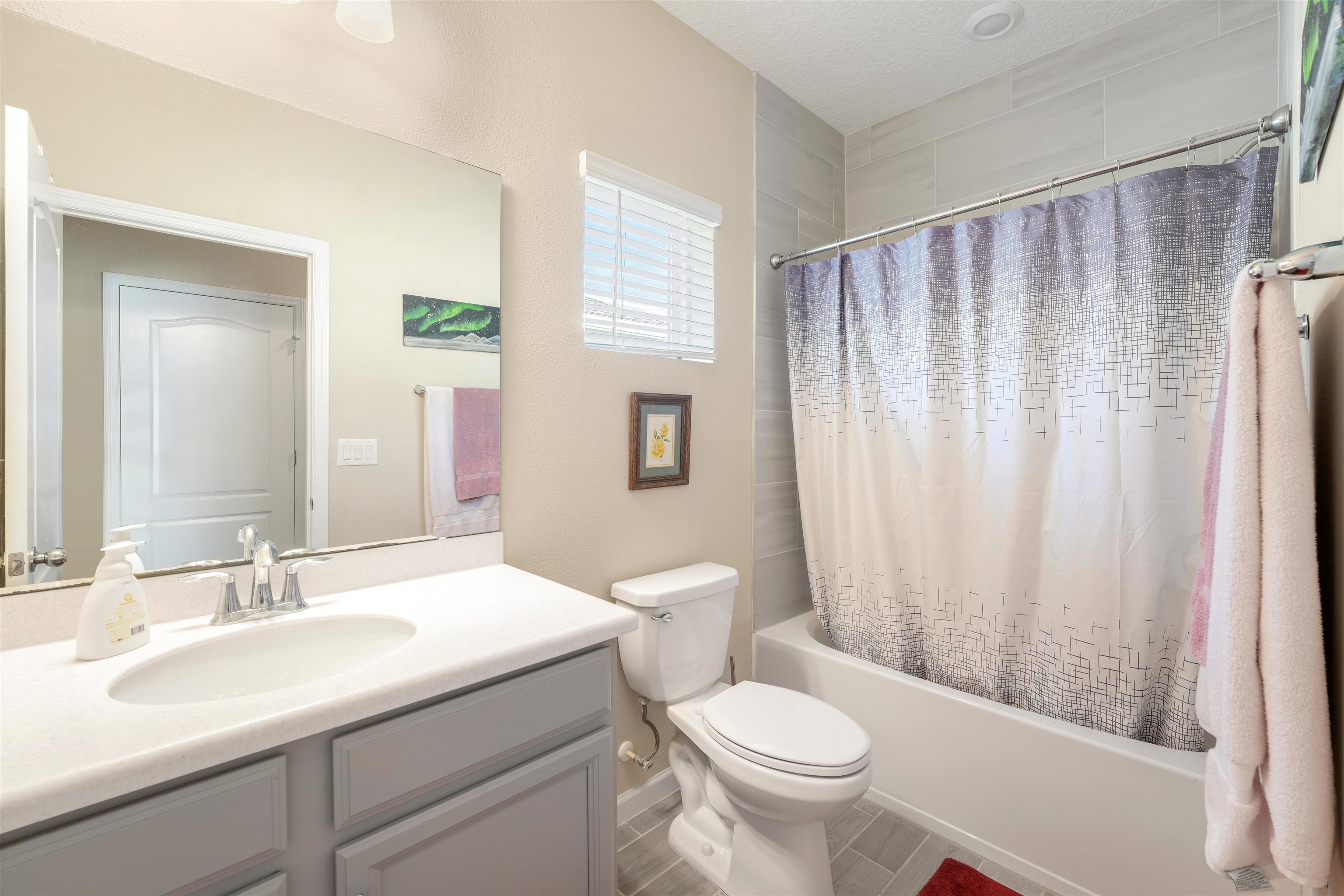 503 Stone Arbor Lane St. Augustine, FL 32086 - Photo 32 of 44 Bathroom featuring shower / bathtub combination with curtain and vanity