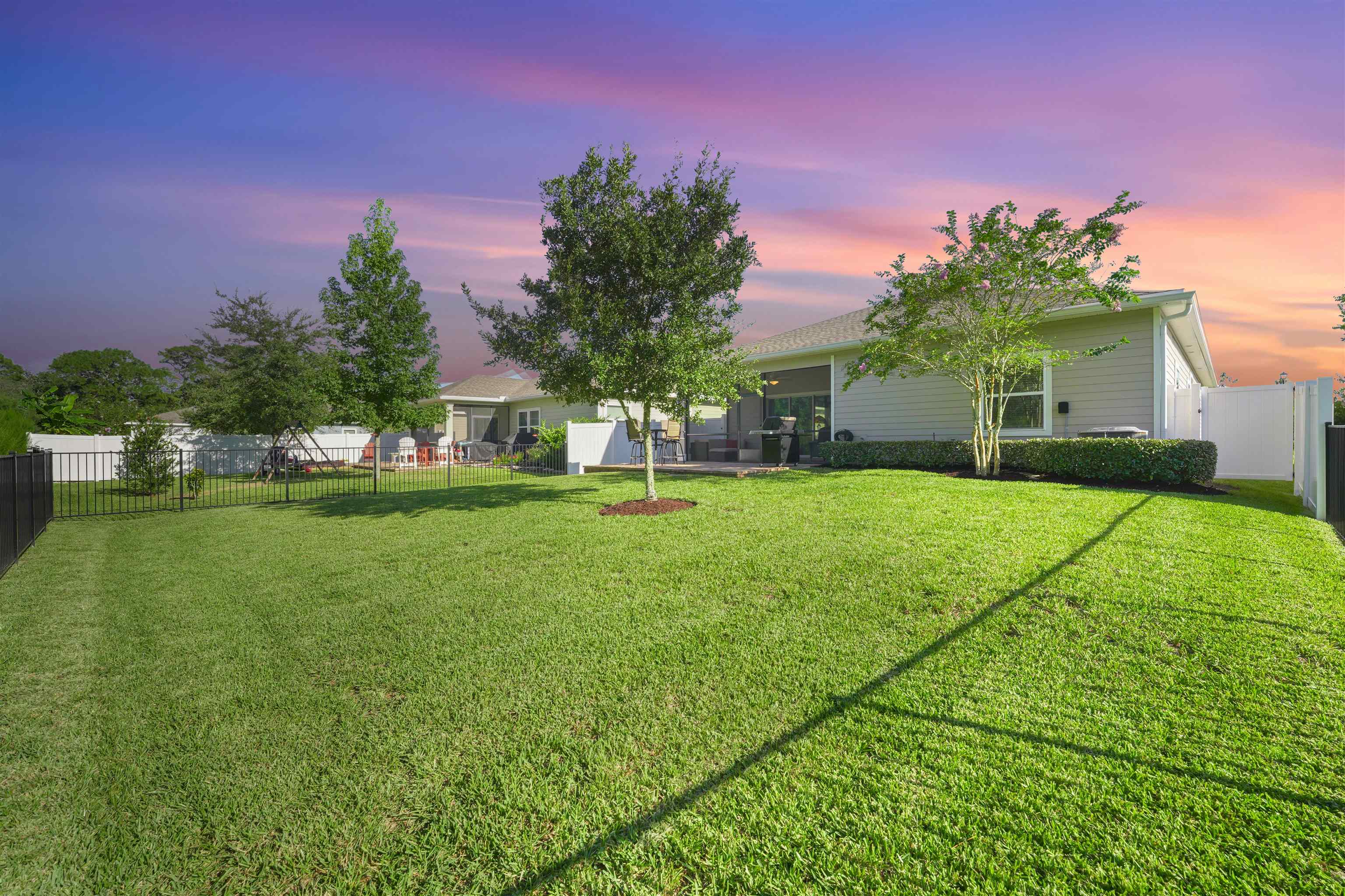 503 Stone Arbor Lane St. Augustine, FL 32086 - Photo 9 of 44 Yard at dusk featuring a fenced backyard and a patio