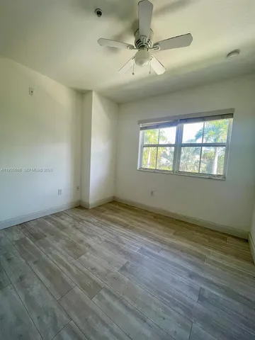 a view of an empty room and window