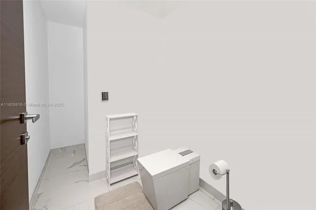 a bathroom with a toilet and a sink