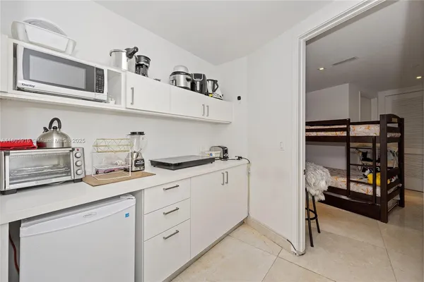 a kitchen with cabinets and window