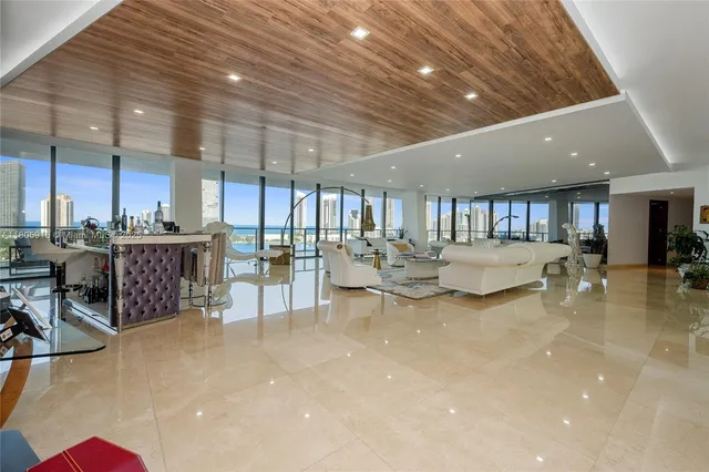 a view of a living room and kitchen