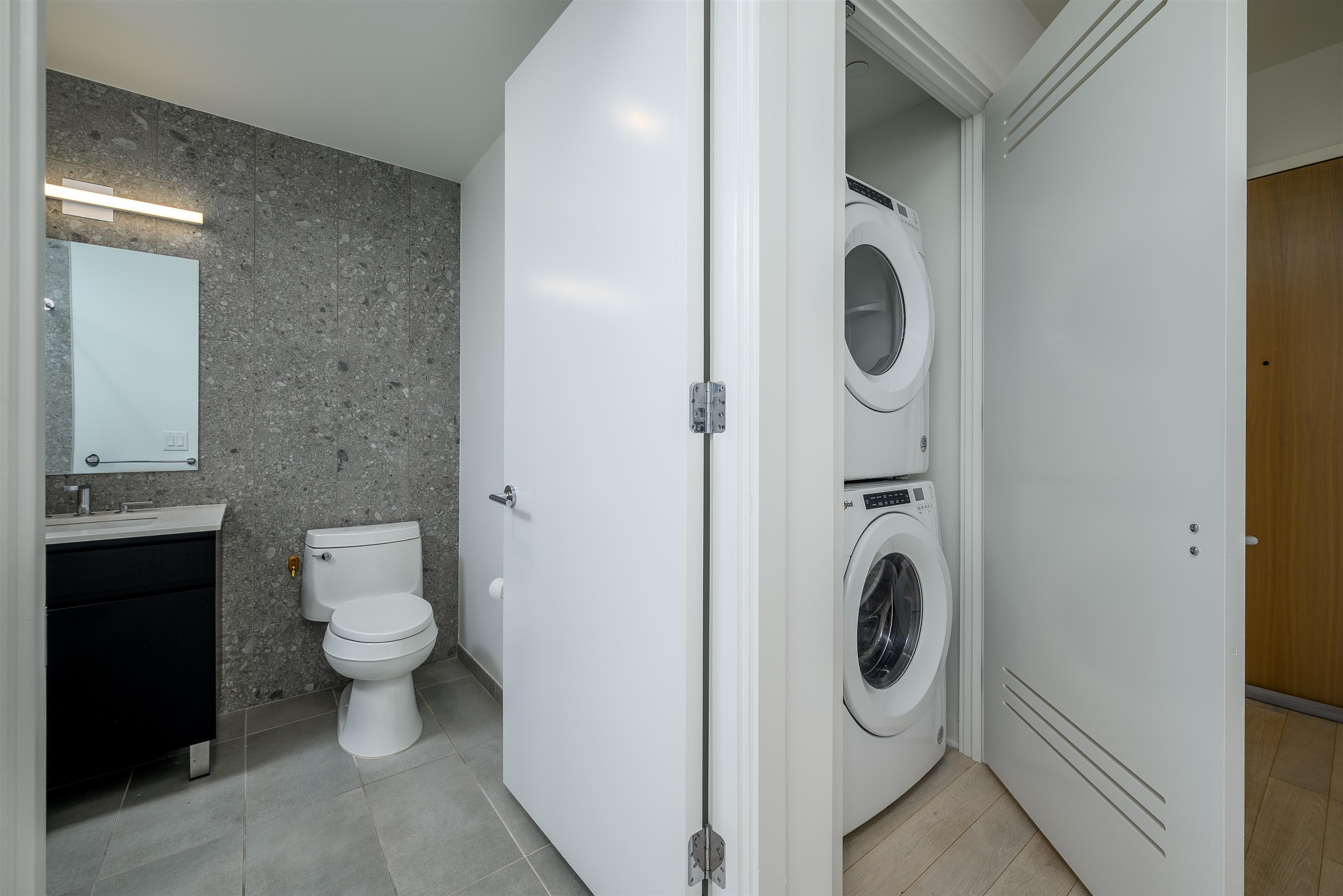 155 Bay Street, Unit R3102 Jersey City, NJ 07302 - Photo 7 of 21 a bathroom with a toilet and a sink