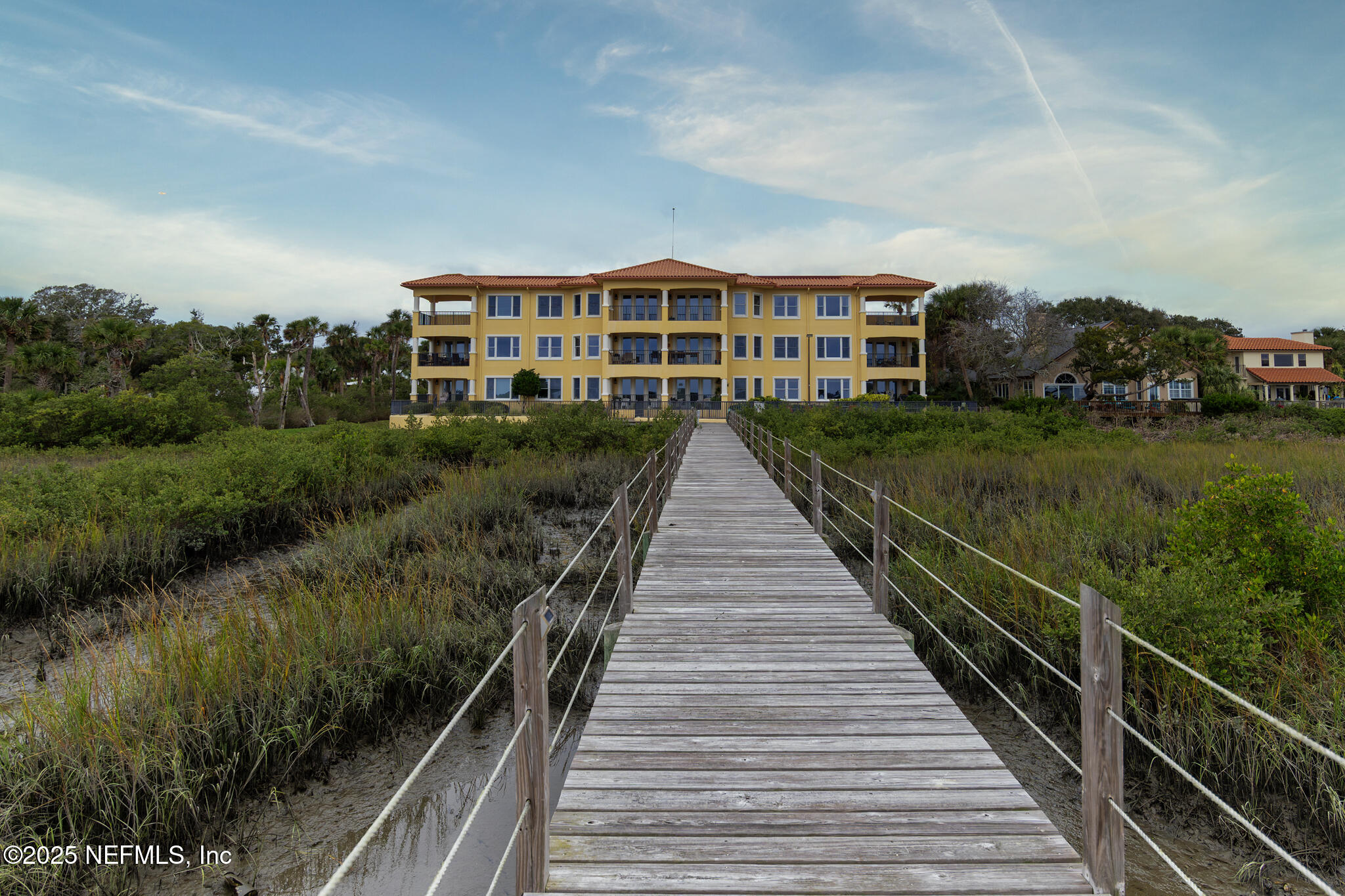 1 Radio Road, Unit 203 St. Augustine, FL 32084 - Photo 52 of 57 a view of a large building with a yard