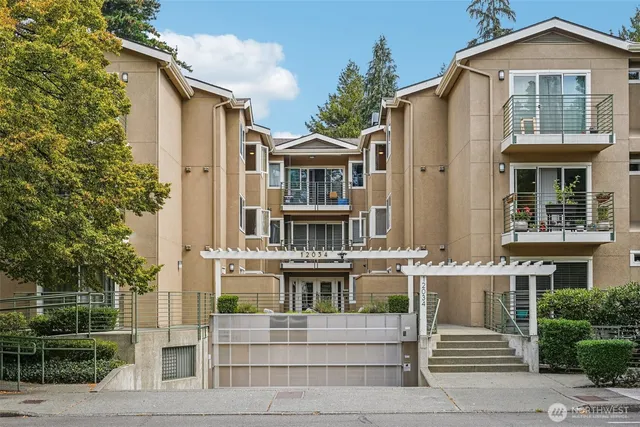 a front view of a residential apartment building with a yard