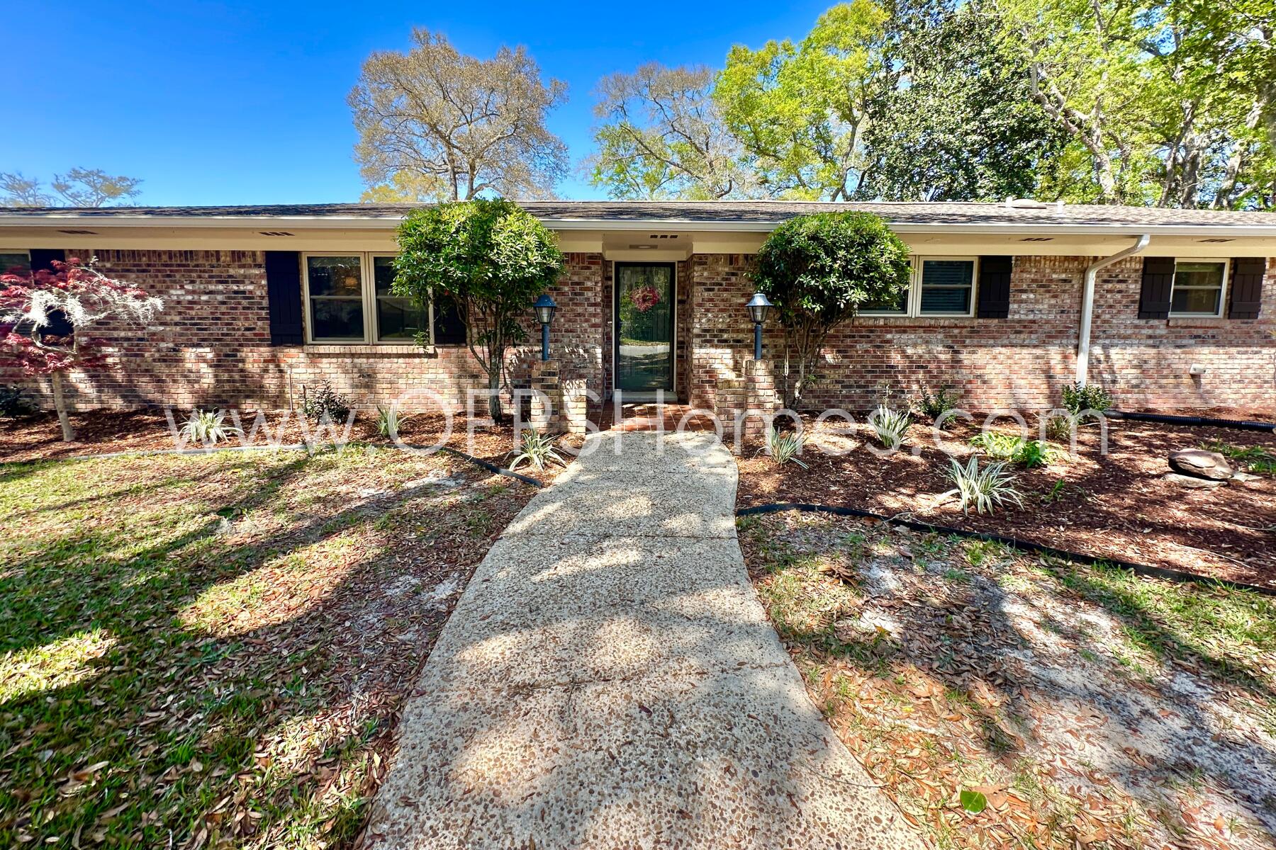 a view of a house with backyard outdoor seating area