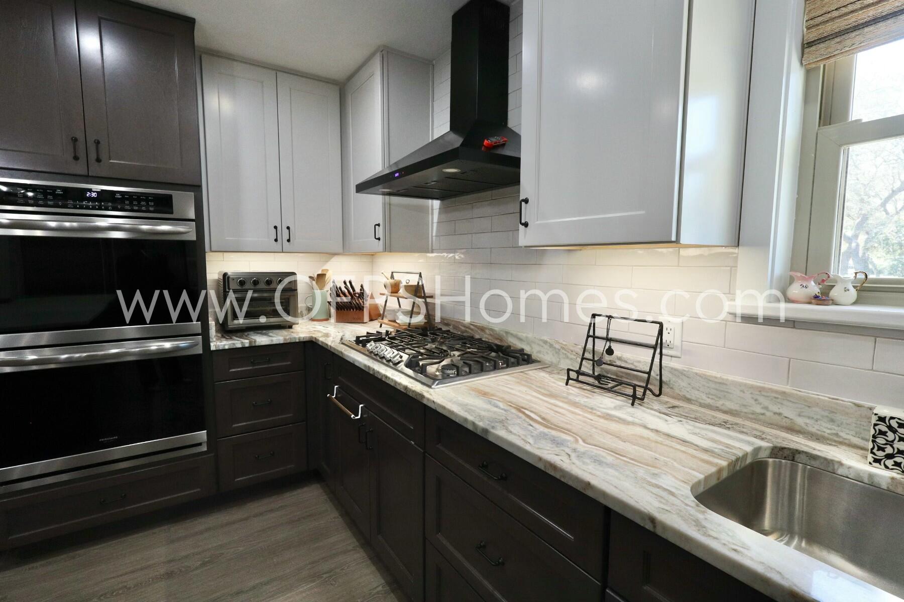 724 Overbrook Drive Fort Walton Beach, FL 32547 - Photo 15 of 47 a kitchen with a sink a stove and cabinets
