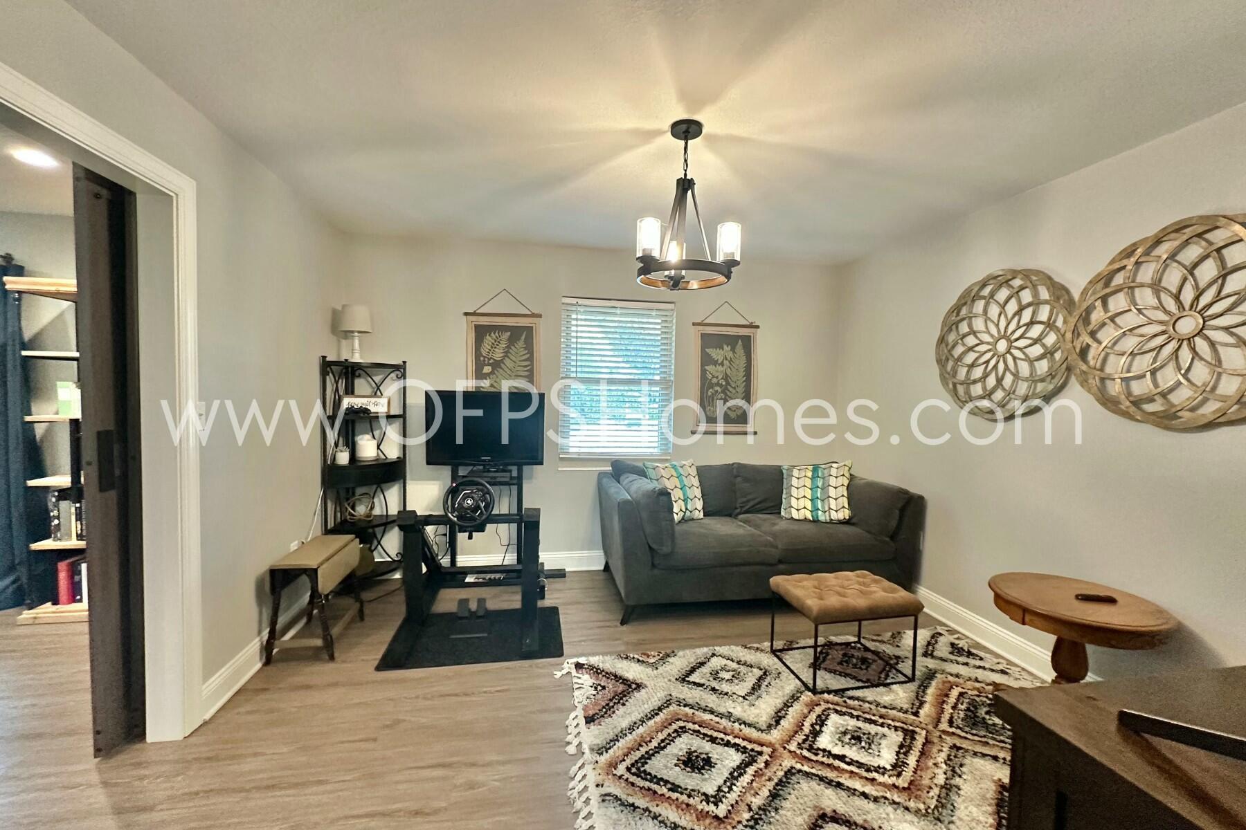 724 Overbrook Drive Fort Walton Beach, FL 32547 - Photo 24 of 47 a living room with furniture and wooden floor