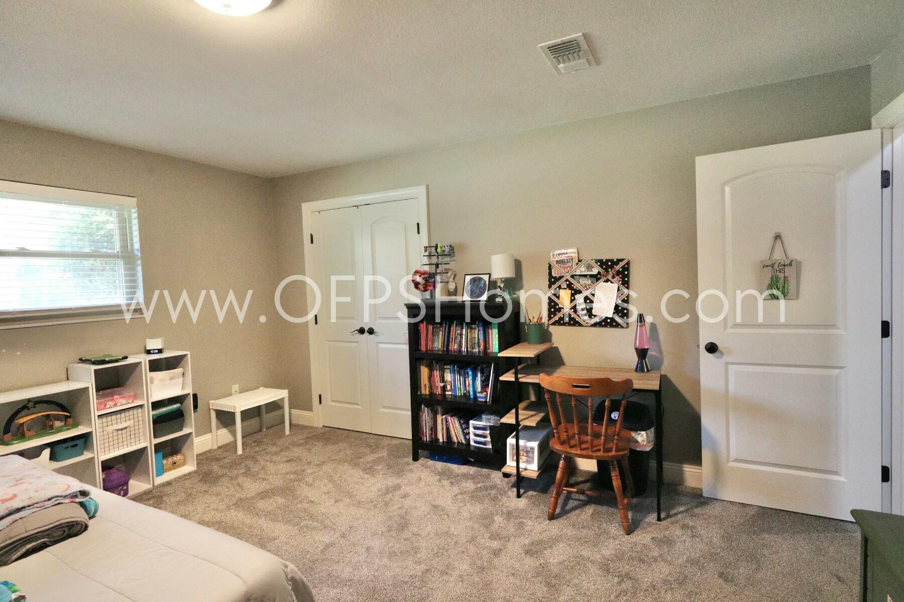 724 Overbrook Drive Fort Walton Beach, FL 32547 - Photo 29 of 47 a bed room with a bed and a chair