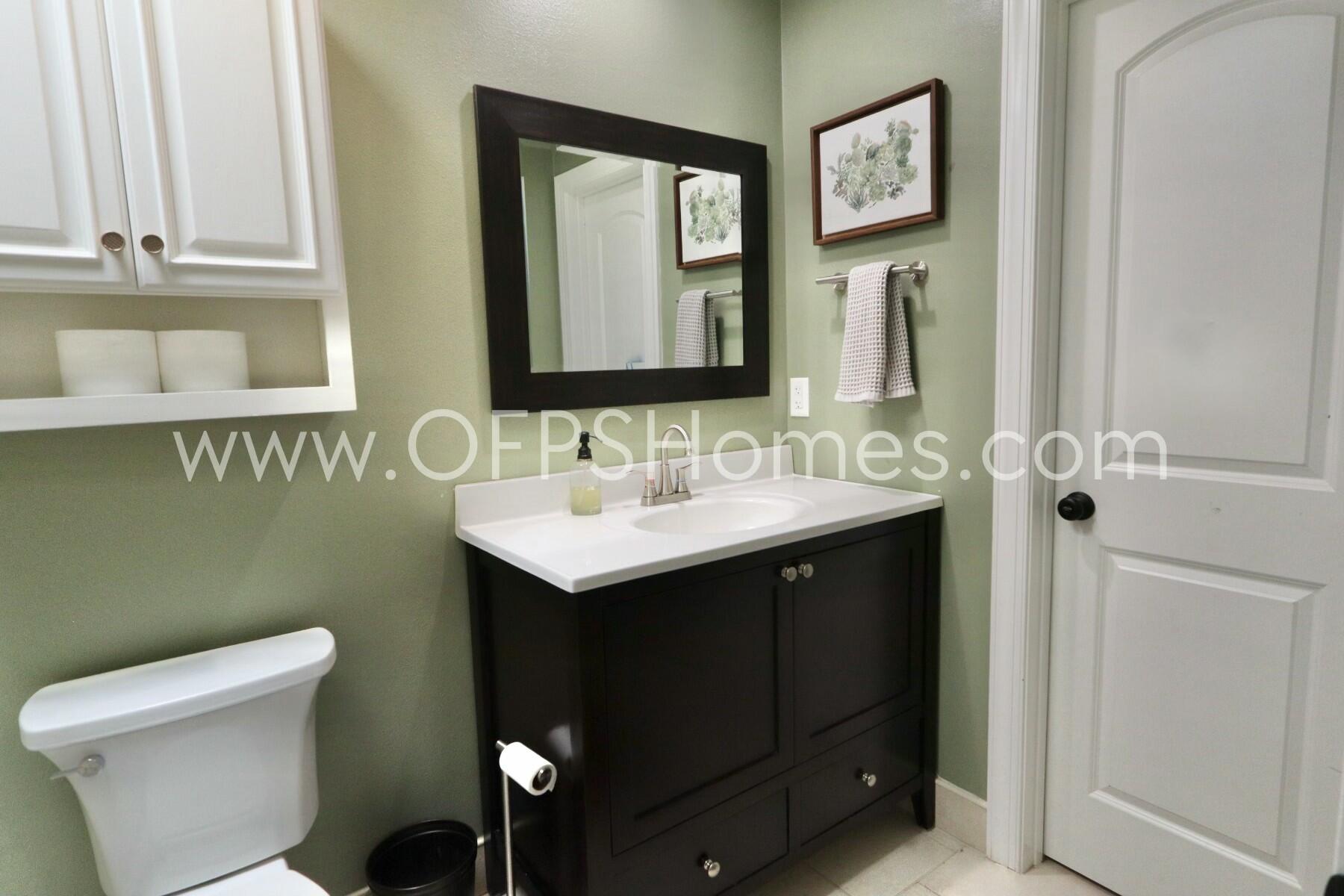 724 Overbrook Drive Fort Walton Beach, FL 32547 - Photo 32 of 47 a bathroom with a sink and a mirror