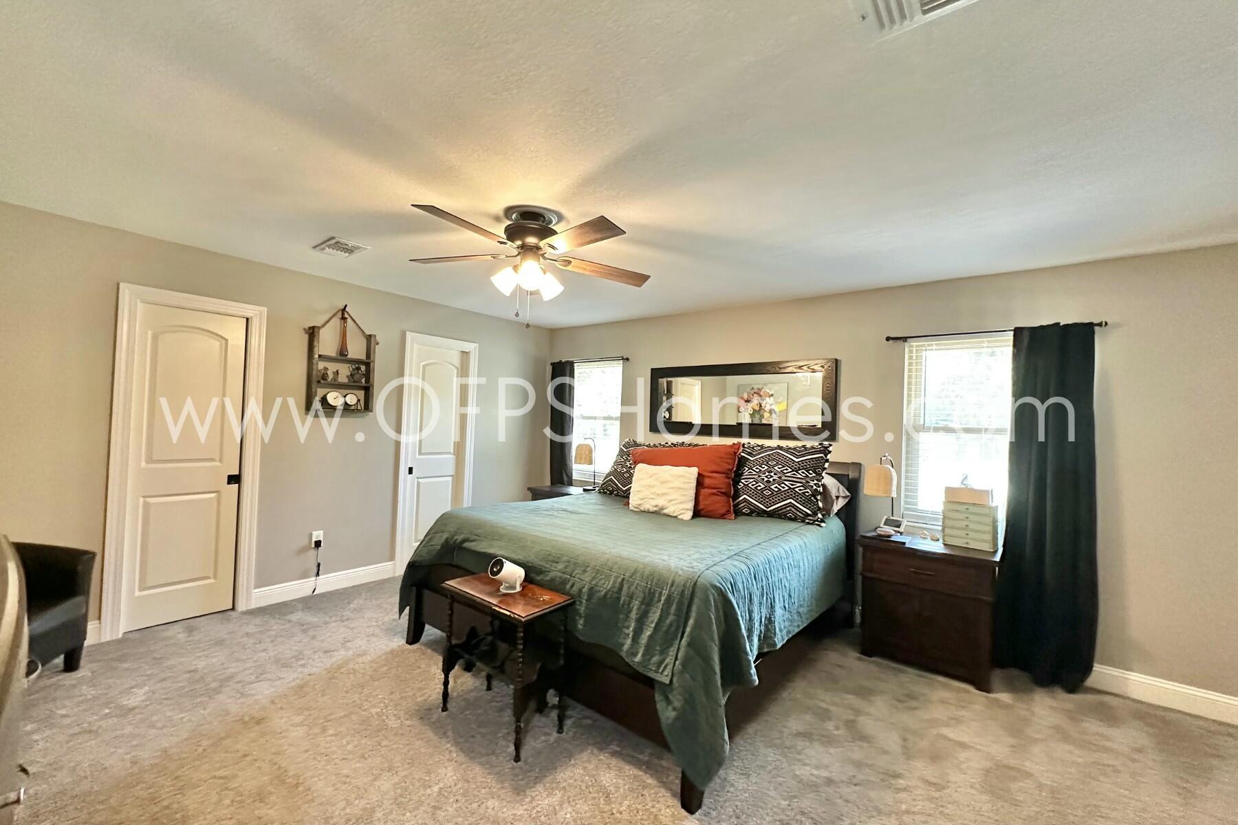 724 Overbrook Drive Fort Walton Beach, FL 32547 - Photo 36 of 47 a bedroom with a bed and a chandelier