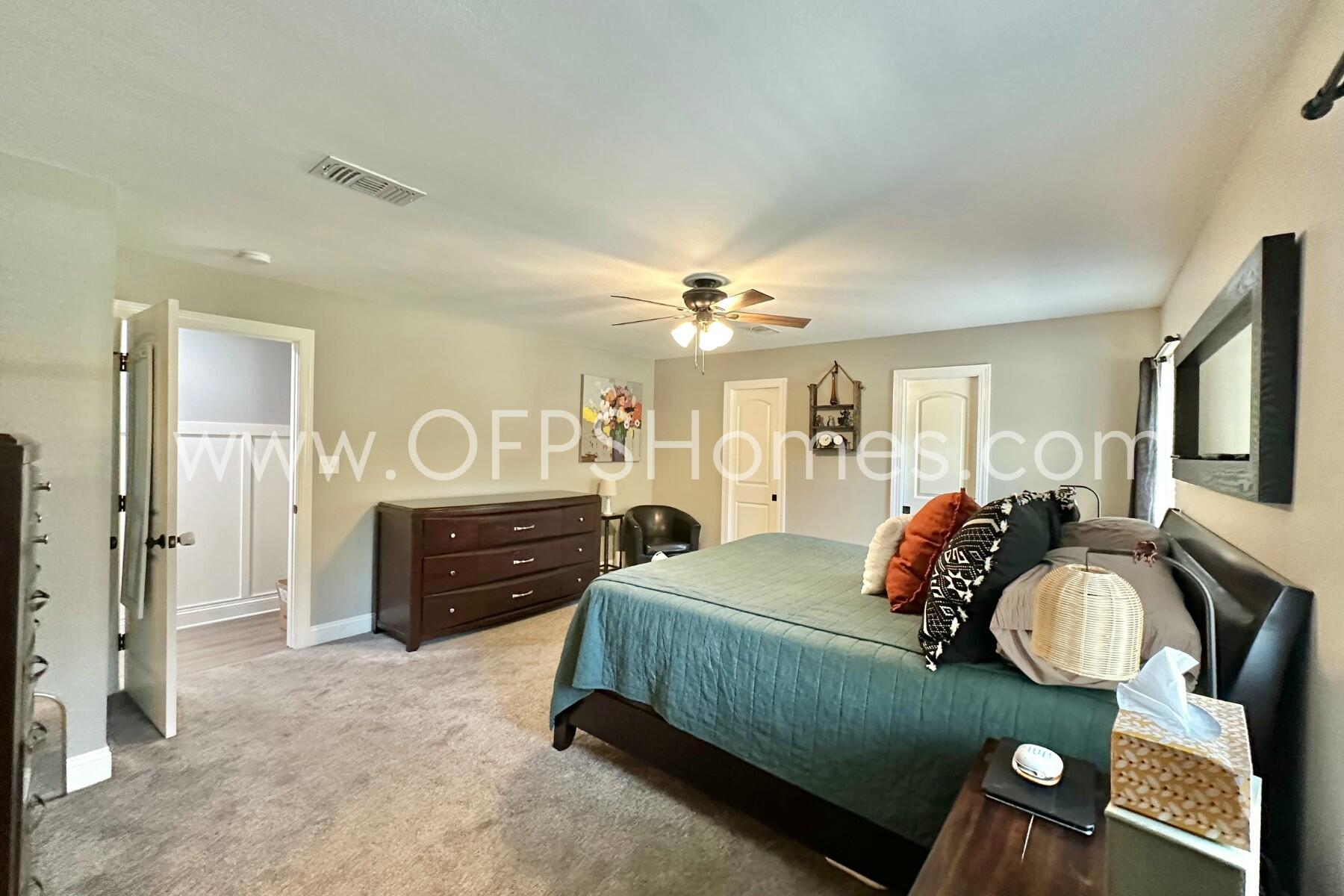 724 Overbrook Drive Fort Walton Beach, FL 32547 - Photo 38 of 47 a bed room with a bed and a bathroom