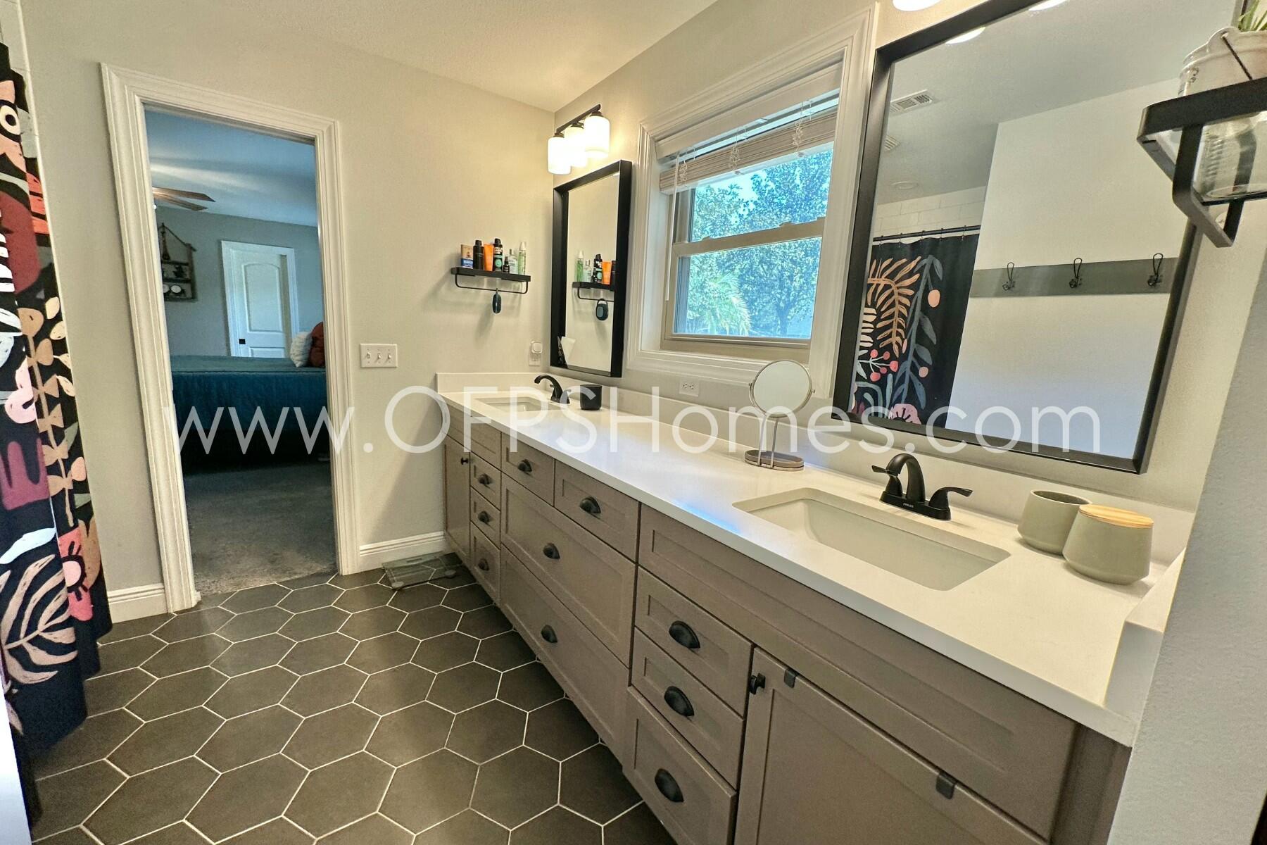 724 Overbrook Drive Fort Walton Beach, FL 32547 - Photo 40 of 47 a spacious bathroom with a double vanity sink mirror and a bathtub