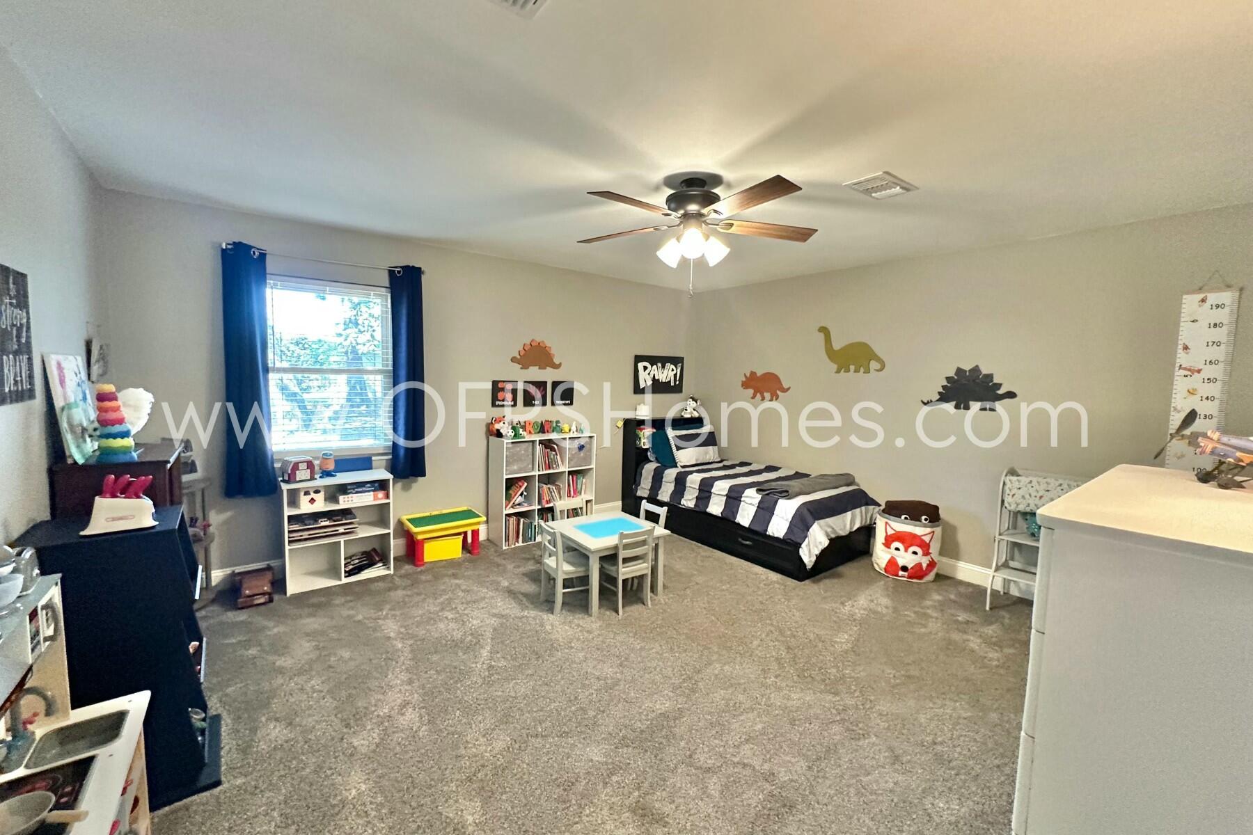 724 Overbrook Drive Fort Walton Beach, FL 32547 - Photo 42 of 47 a bedroom with furniture and a chandelier