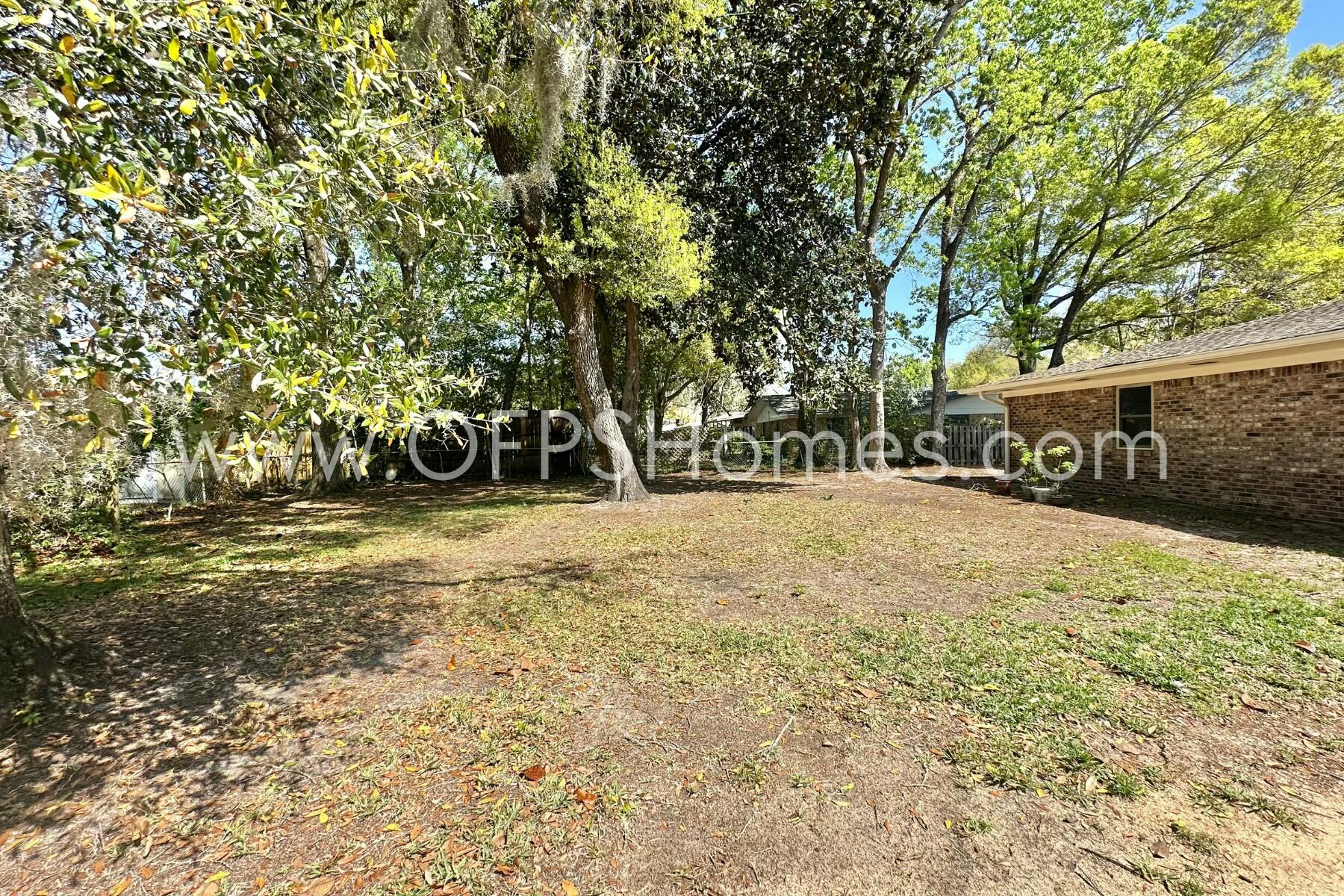 724 Overbrook Drive Fort Walton Beach, FL 32547 - Photo 46 of 47 a house with trees in front of it
