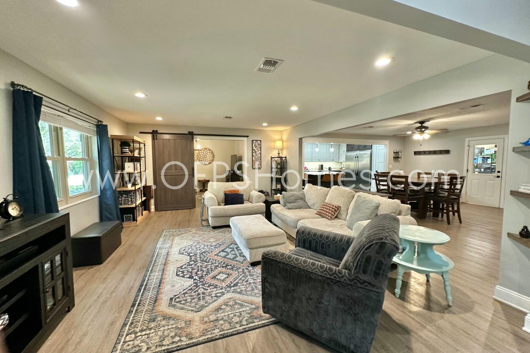 724 Overbrook Drive Fort Walton Beach, FL 32547 - Photo 7 of 47 a living room with furniture and a flat screen tv