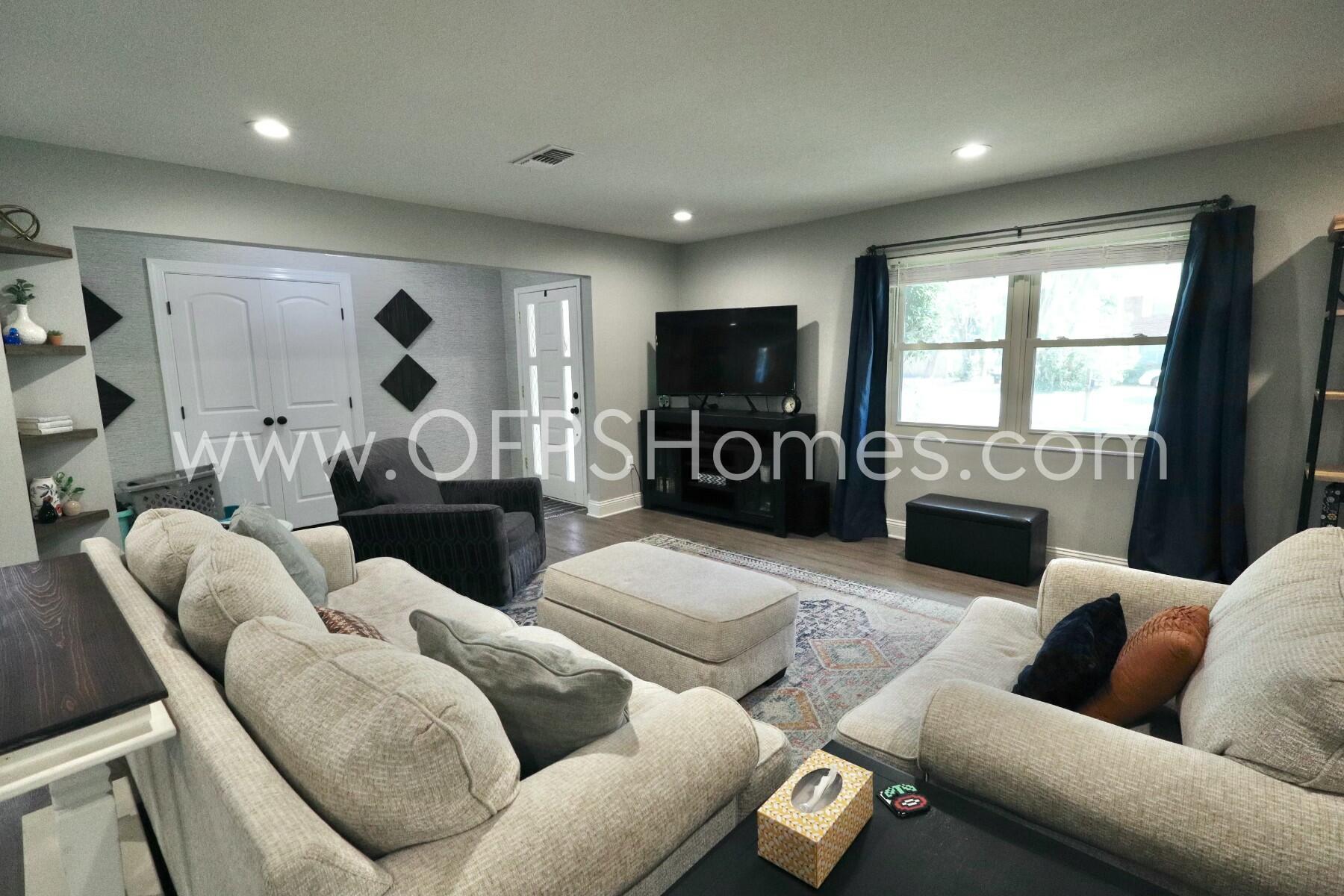 724 Overbrook Drive Fort Walton Beach, FL 32547 - Photo 8 of 47 a living room with furniture and a flat screen tv