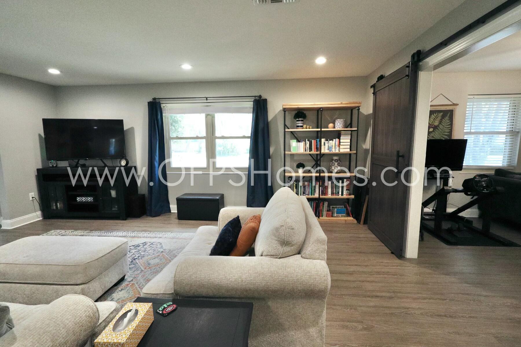 724 Overbrook Drive Fort Walton Beach, FL 32547 - Photo 9 of 47 a living room with furniture and a flat screen tv