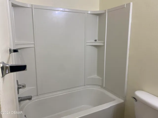 a close view of a bathtub in bathroom
