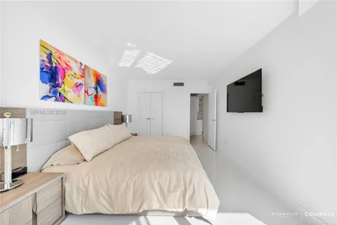 a bathroom with a sink mirror vanity and toilet