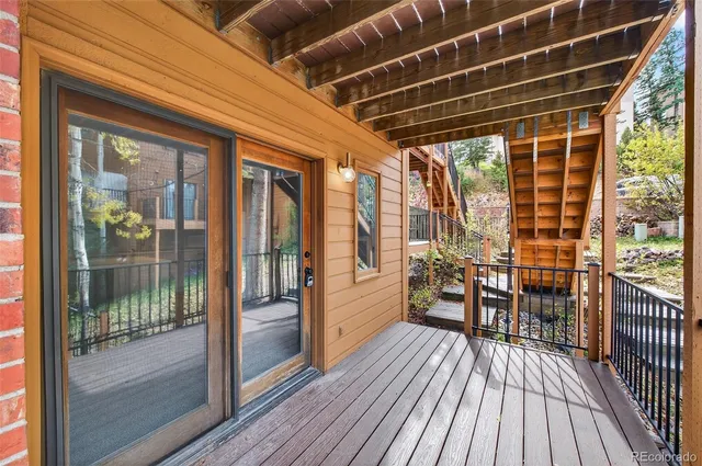 a view of a balcony with wooden floor