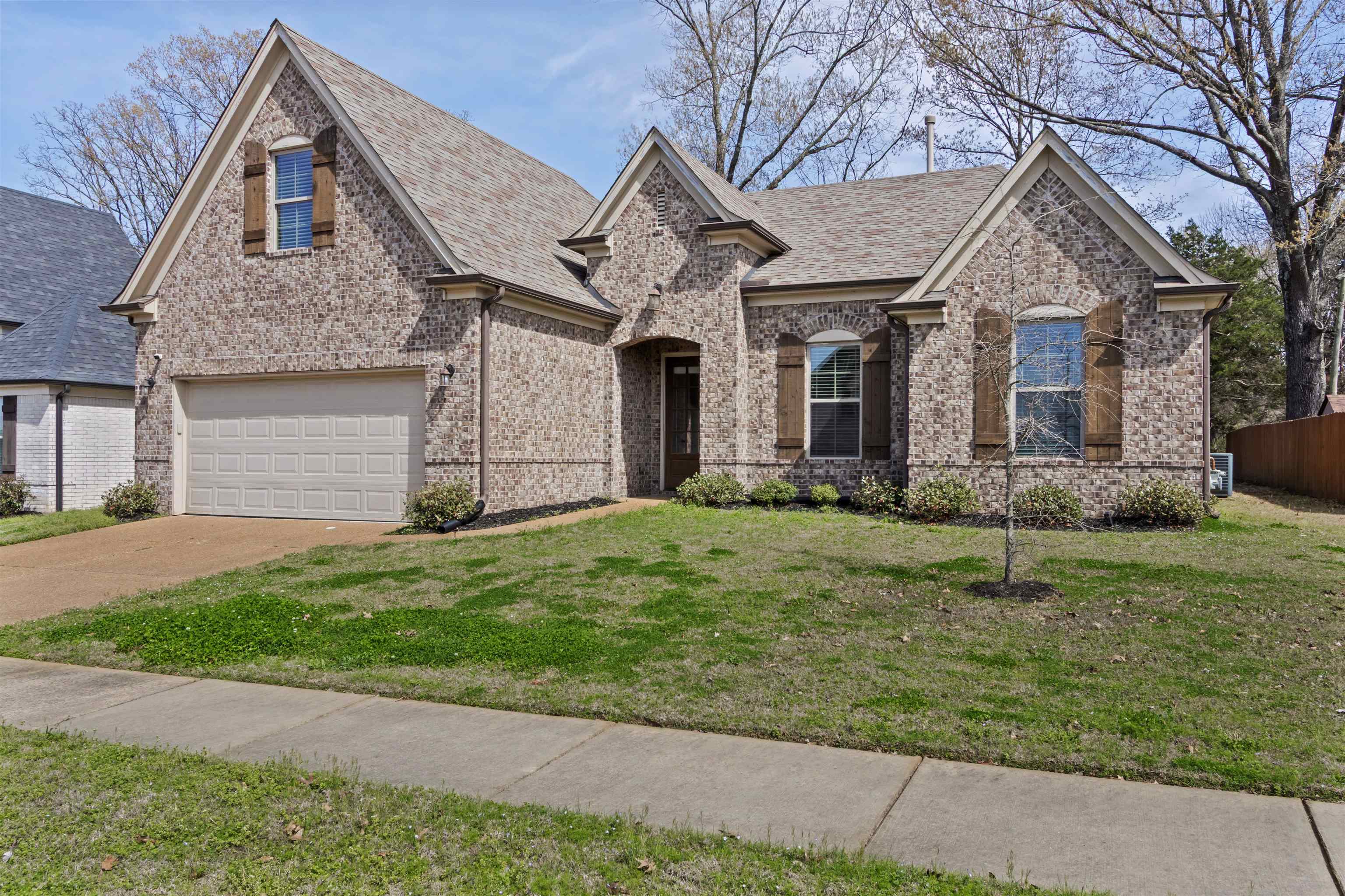 4996 Granite Creek Road Memphis, TN 38125 - Photo 2 of 37 a house view with a garden space