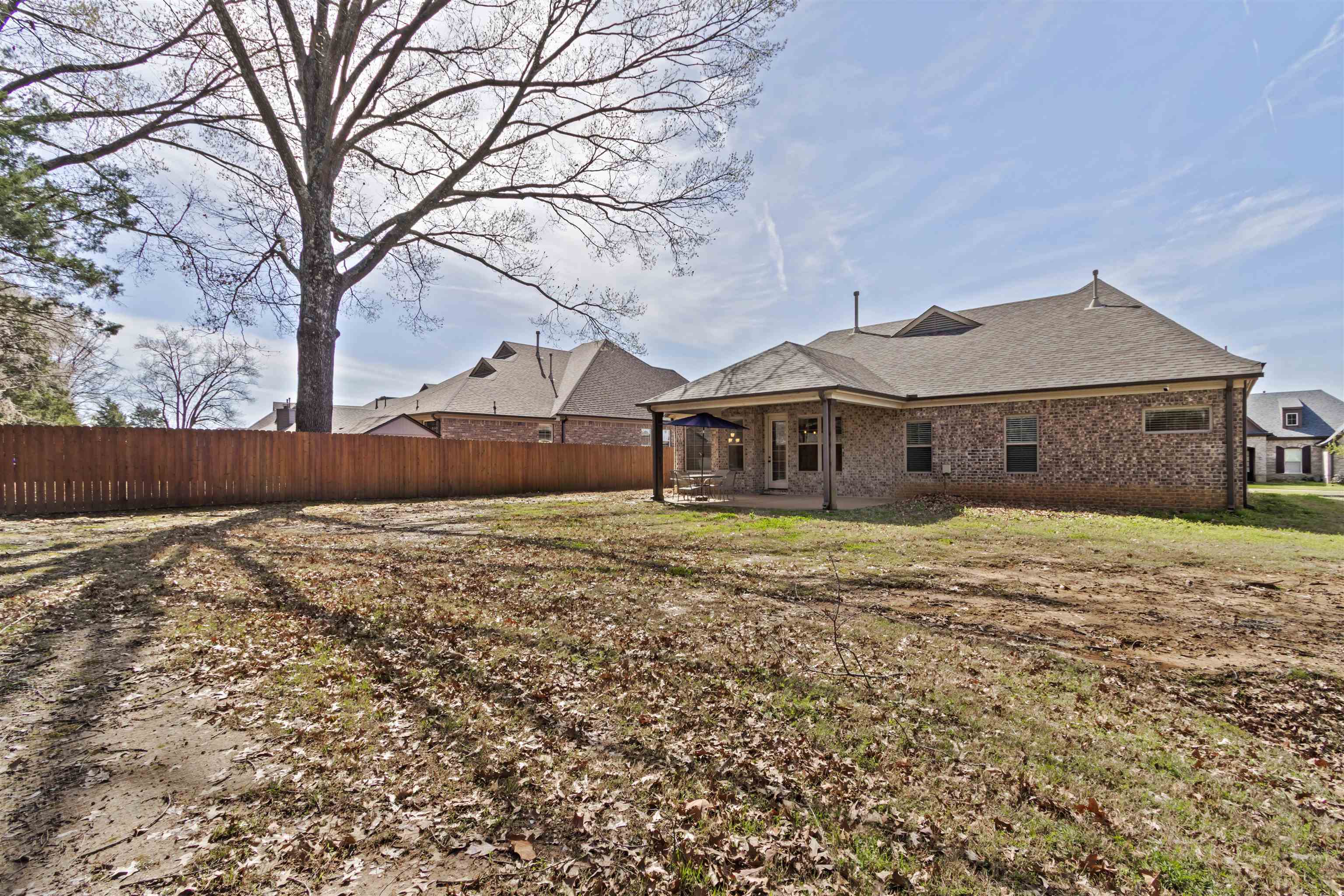 4996 Granite Creek Road Memphis, TN 38125 - Photo 28 of 37 a front view of a house with garden
