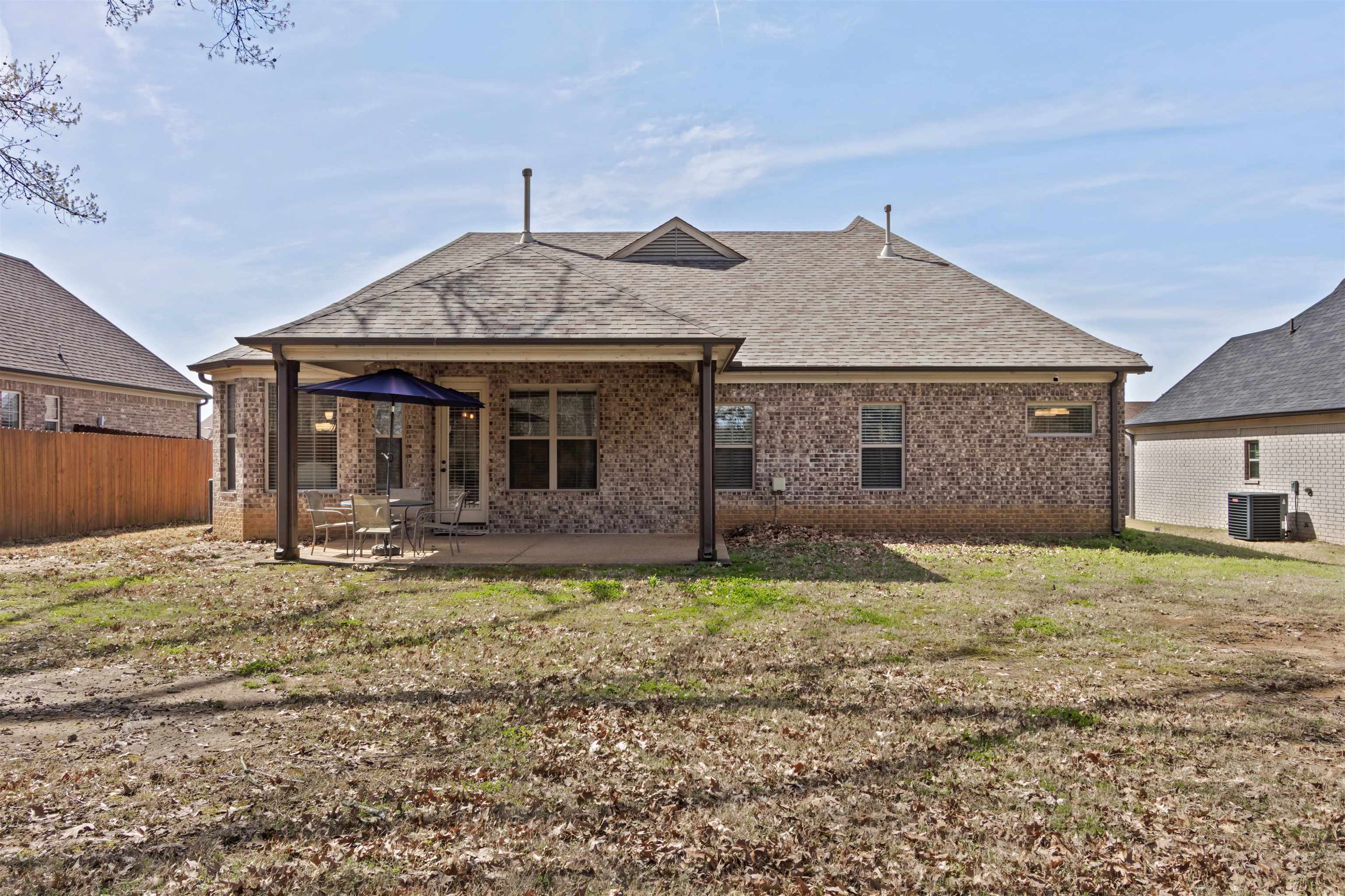 4996 Granite Creek Road Memphis, TN 38125 - Photo 29 of 37 a front view of a house with a yard