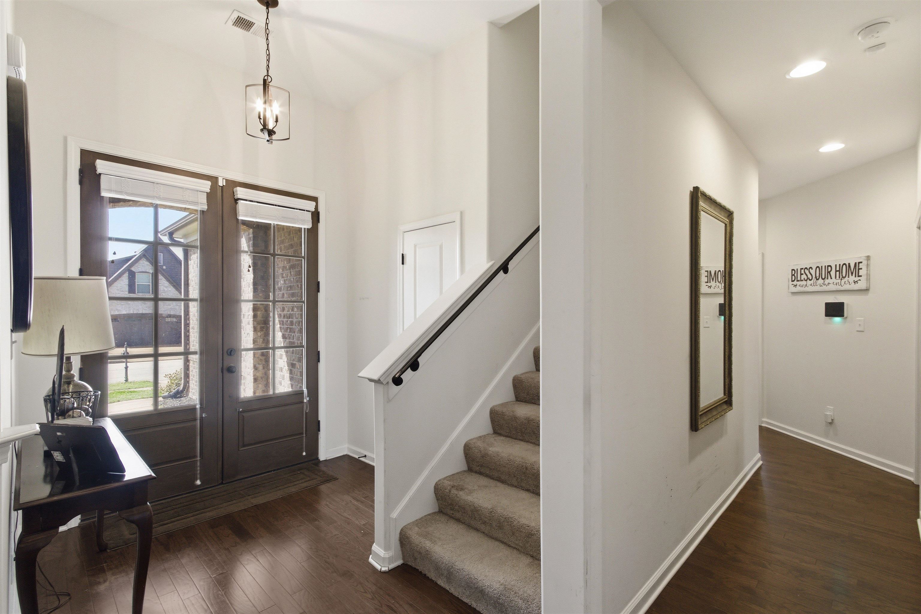4996 Granite Creek Road Memphis, TN 38125 - Photo 5 of 37 a view of entryway with wooden floor and stairs