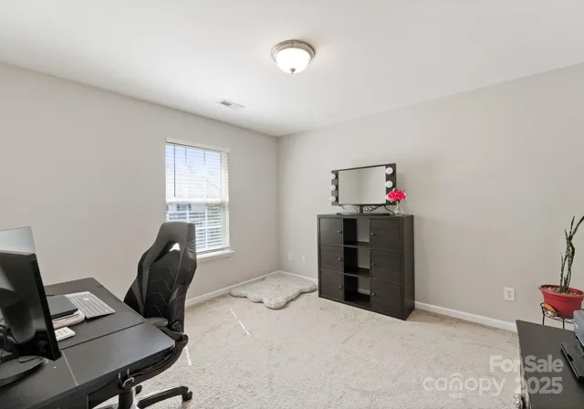 a workspace with furniture and window