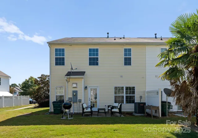 a view of a house with swimming pool in front of it