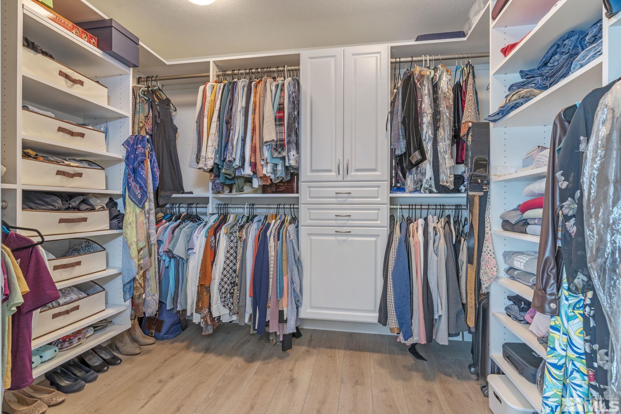 11300 Parma Court Reno, NV 89521 - Photo 28 of 40 a view of walk in closet with clothes