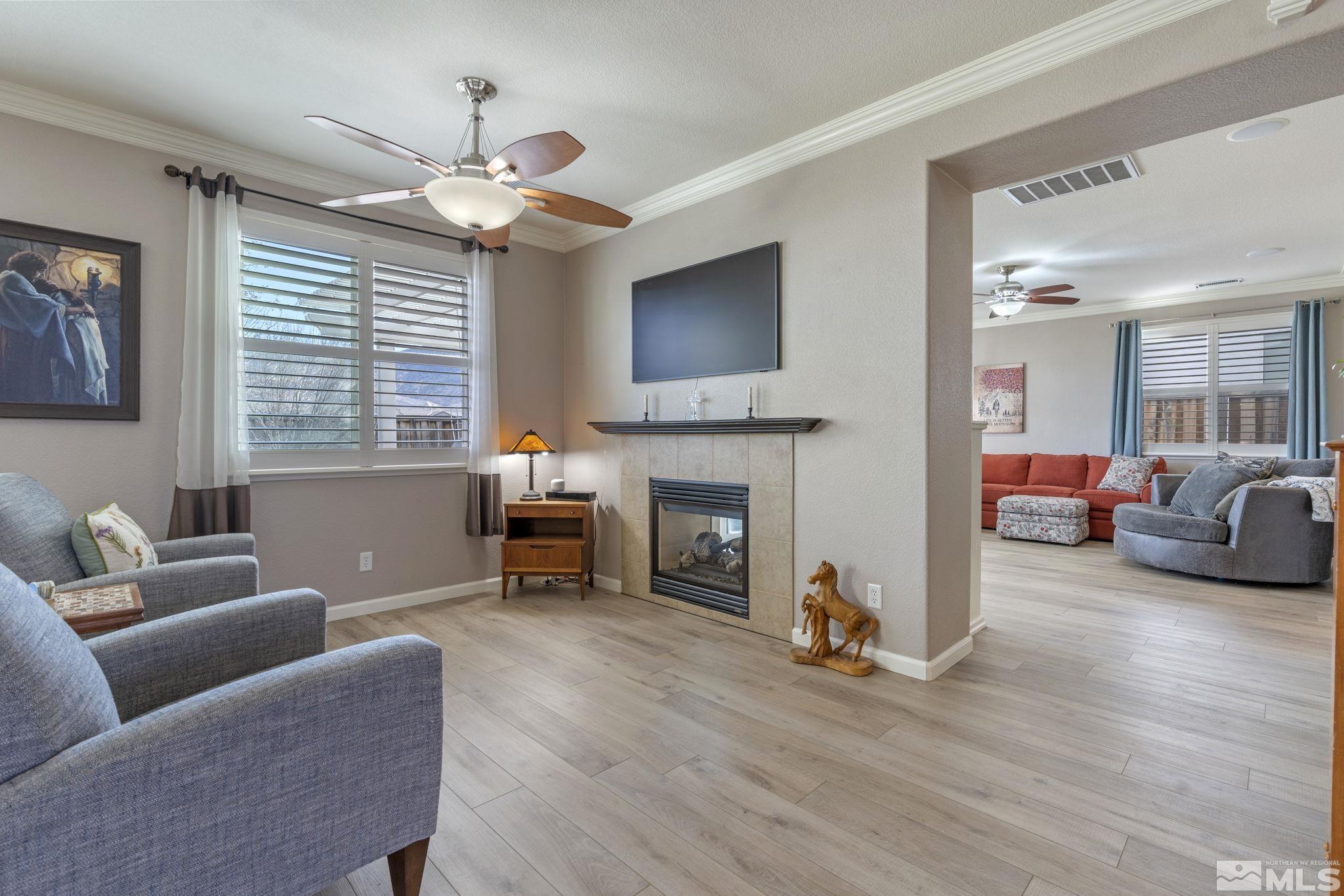 11300 Parma Court Reno, NV 89521 - Photo 6 of 40 a living room with furniture and a fireplace