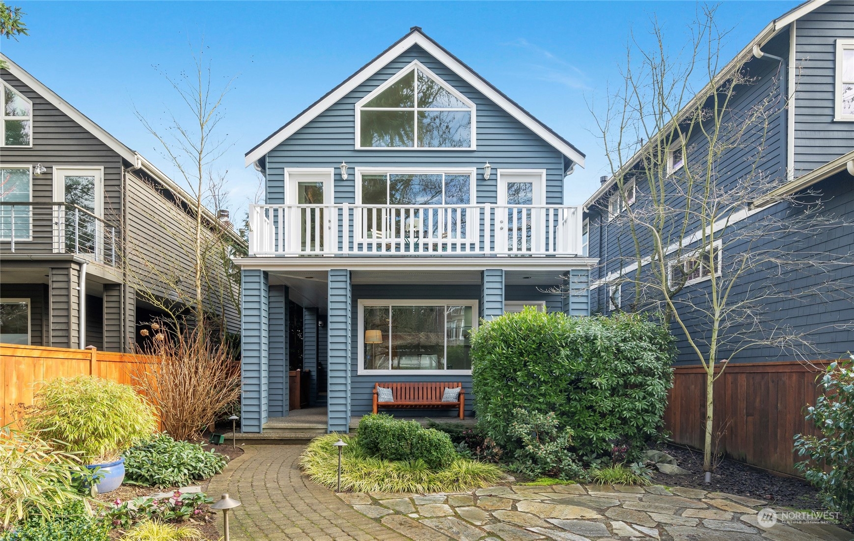 1624 38th Avenue East Seattle, WA 98112 - Photo 1 of 39 a front view of a house with garden