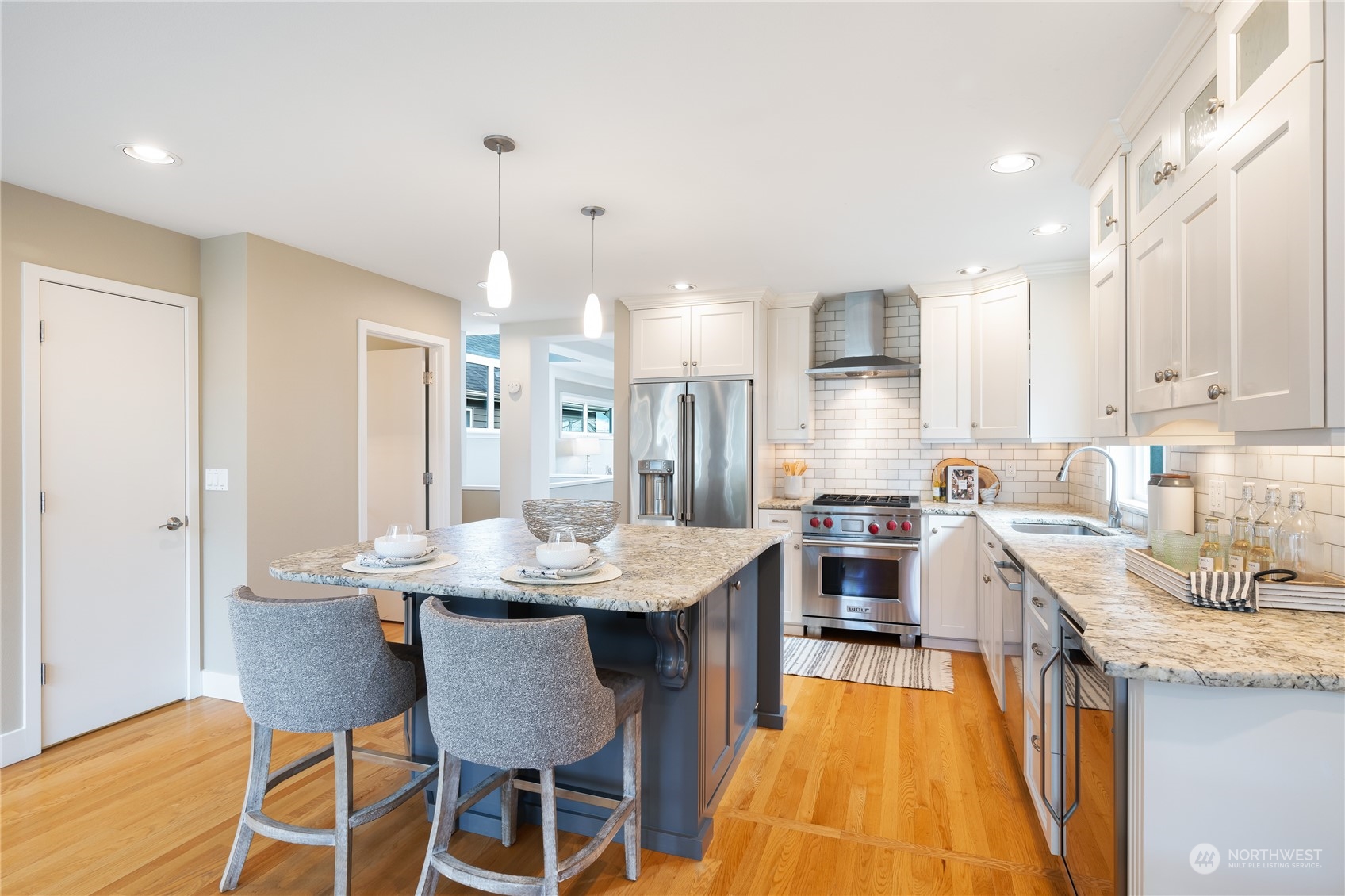 1624 38th Avenue East Seattle, WA 98112 - Photo 13 of 39 a large kitchen with a table and chairs