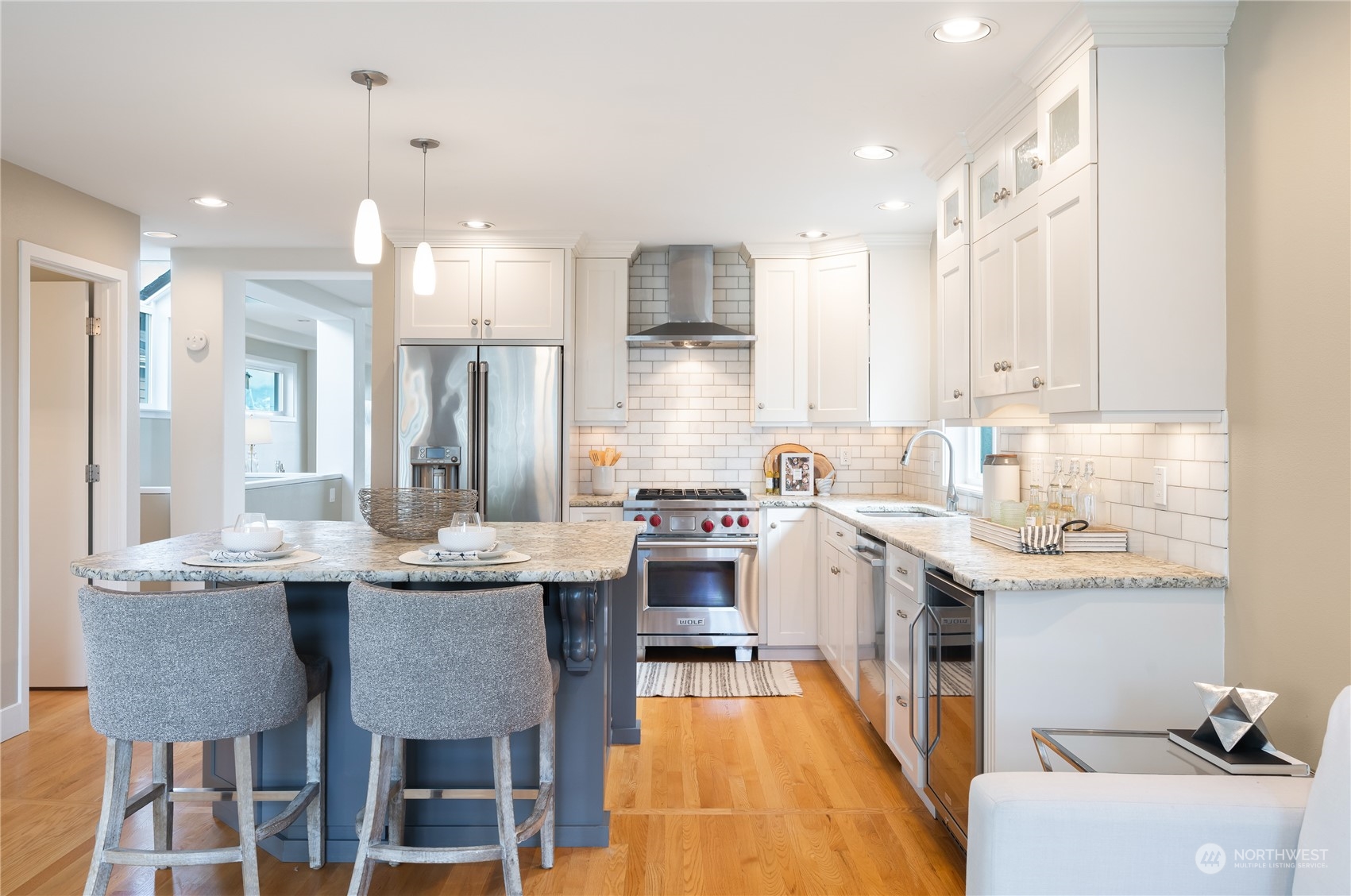 1624 38th Avenue East Seattle, WA 98112 - Photo 14 of 39 a large kitchen with a table and chairs