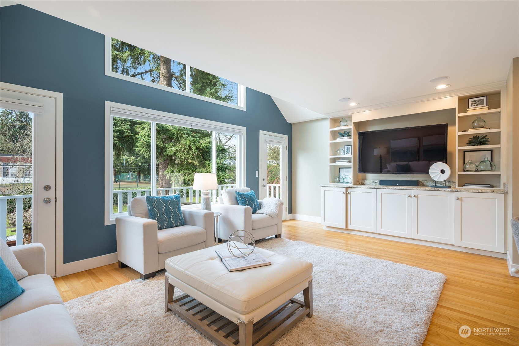 1624 38th Avenue East Seattle, WA 98112 - Photo 18 of 39 a living room with furniture and a flat screen tv