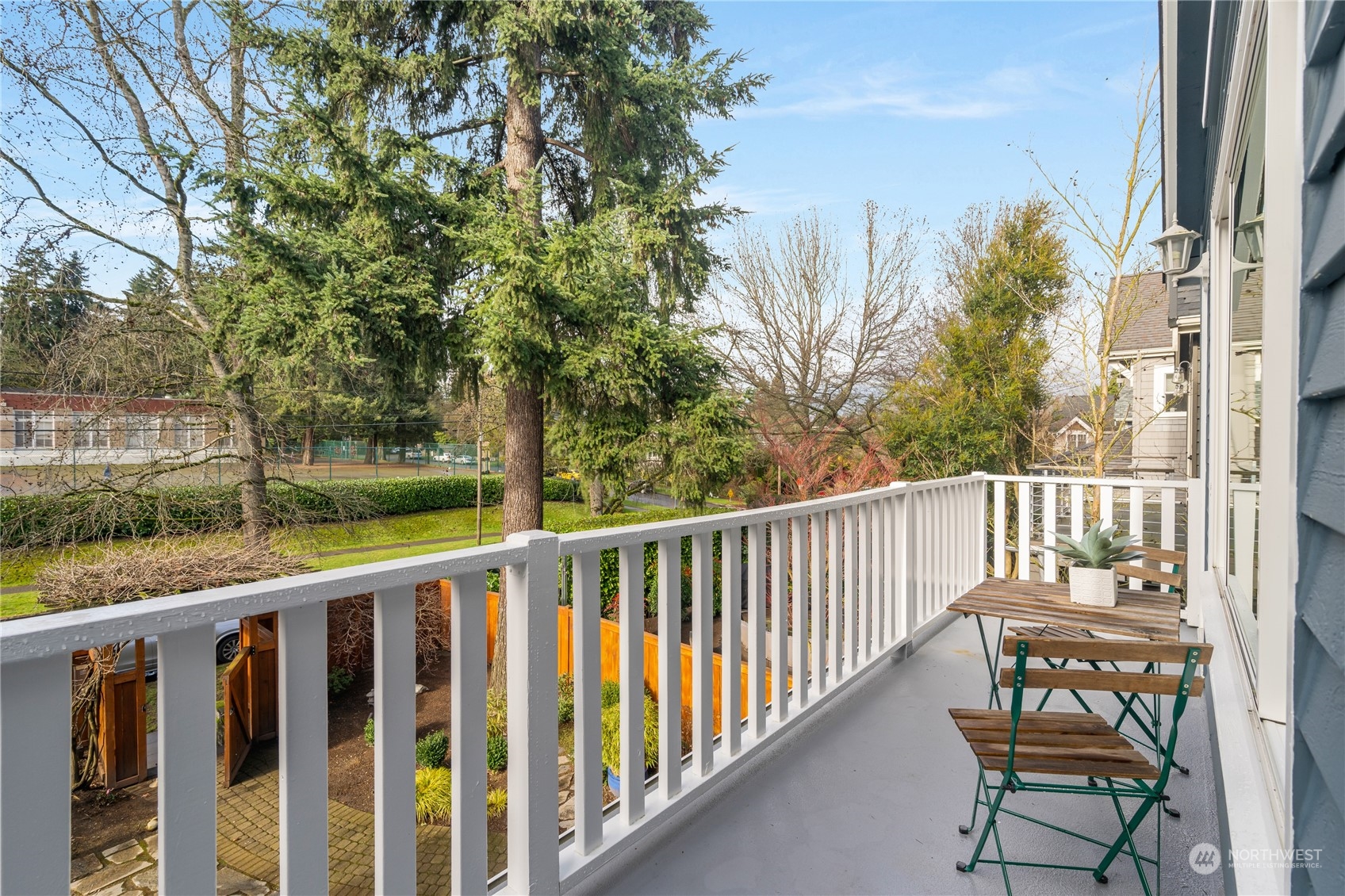 1624 38th Avenue East Seattle, WA 98112 - Photo 19 of 39 a view of a balcony with wooden floor and fence