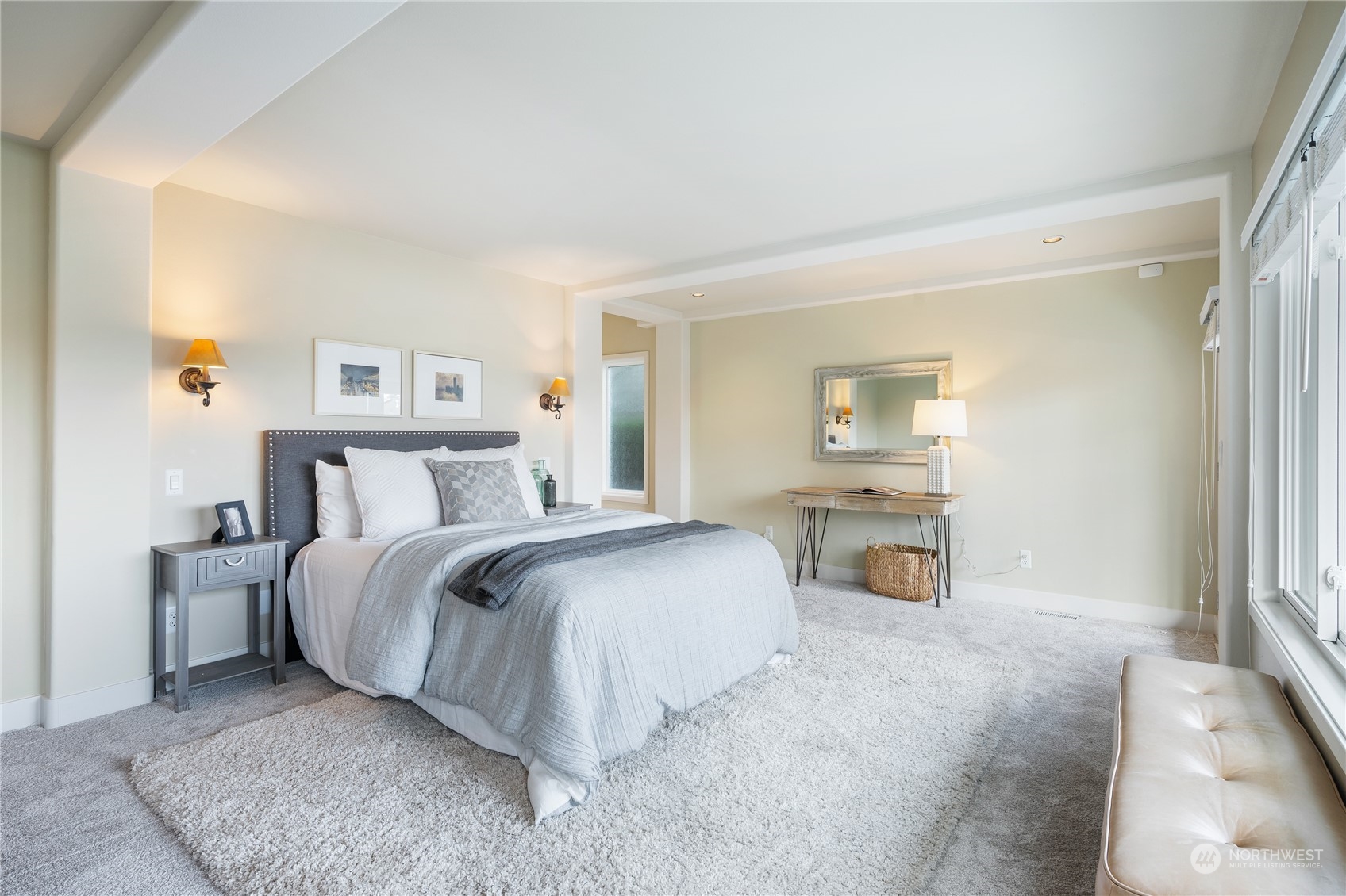 1624 38th Avenue East Seattle, WA 98112 - Photo 22 of 39 a spacious bedroom with a bed couch and a window
