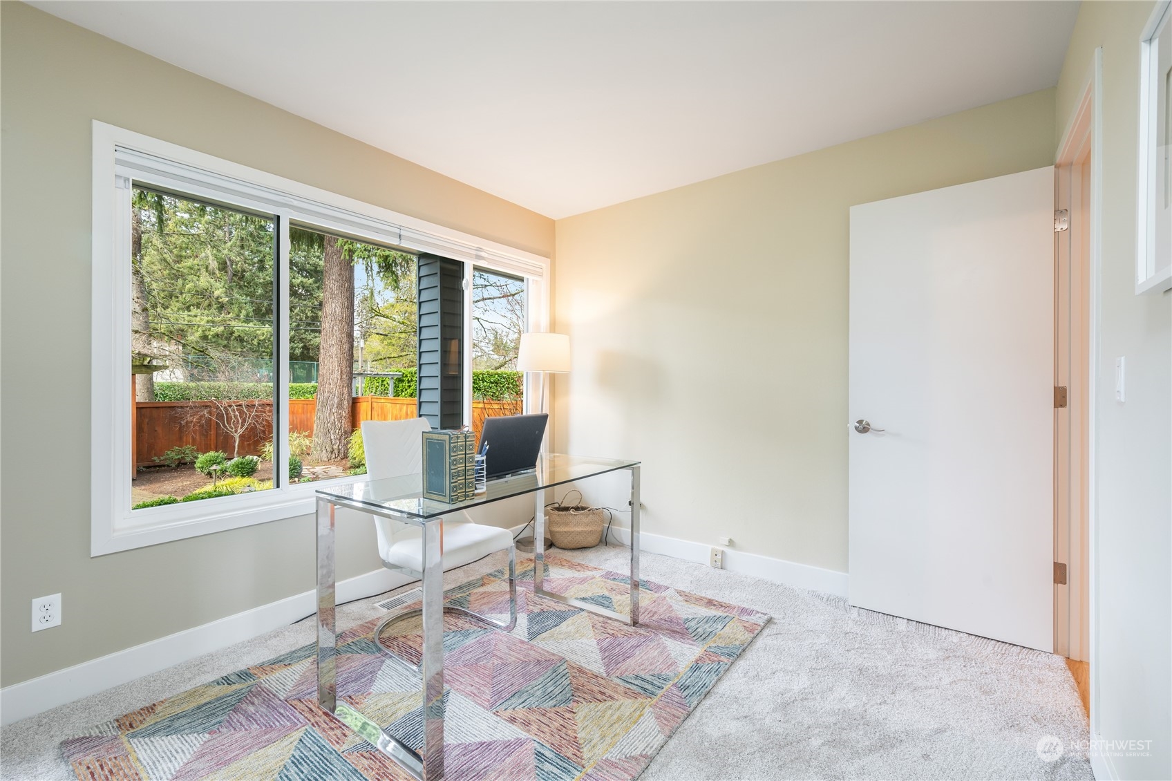 1624 38th Avenue East Seattle, WA 98112 - Photo 28 of 39 a workspace with wooden floor and a window