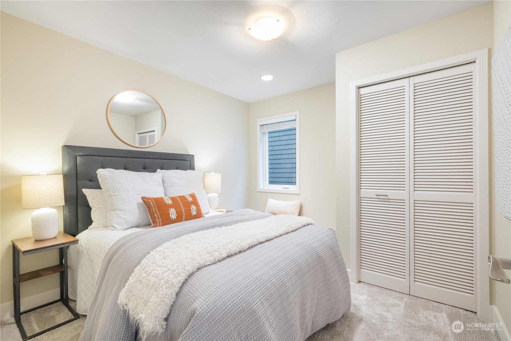 1624 38th Avenue East Seattle, WA 98112 - Photo 29 of 39 a bedroom with a bed and a painting on the wall