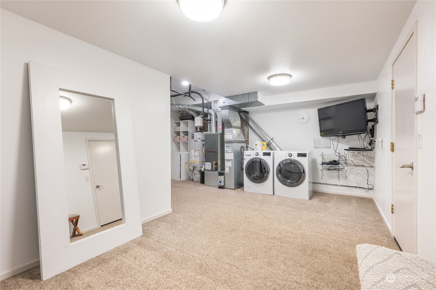 1624 38th Avenue East Seattle, WA 98112 - Photo 32 of 39 a view of a storage and utility room with a lot of white walls