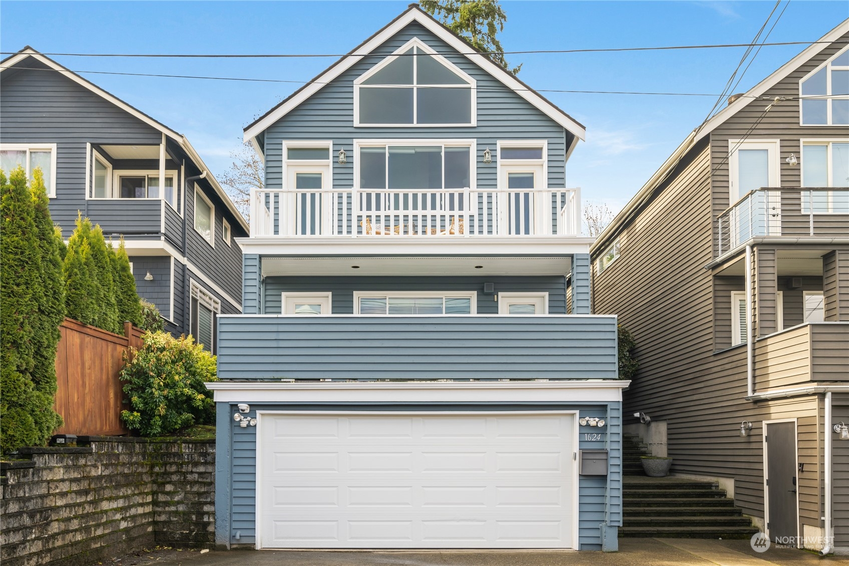 1624 38th Avenue East Seattle, WA 98112 - Photo 34 of 39 a front view of a house with a yard