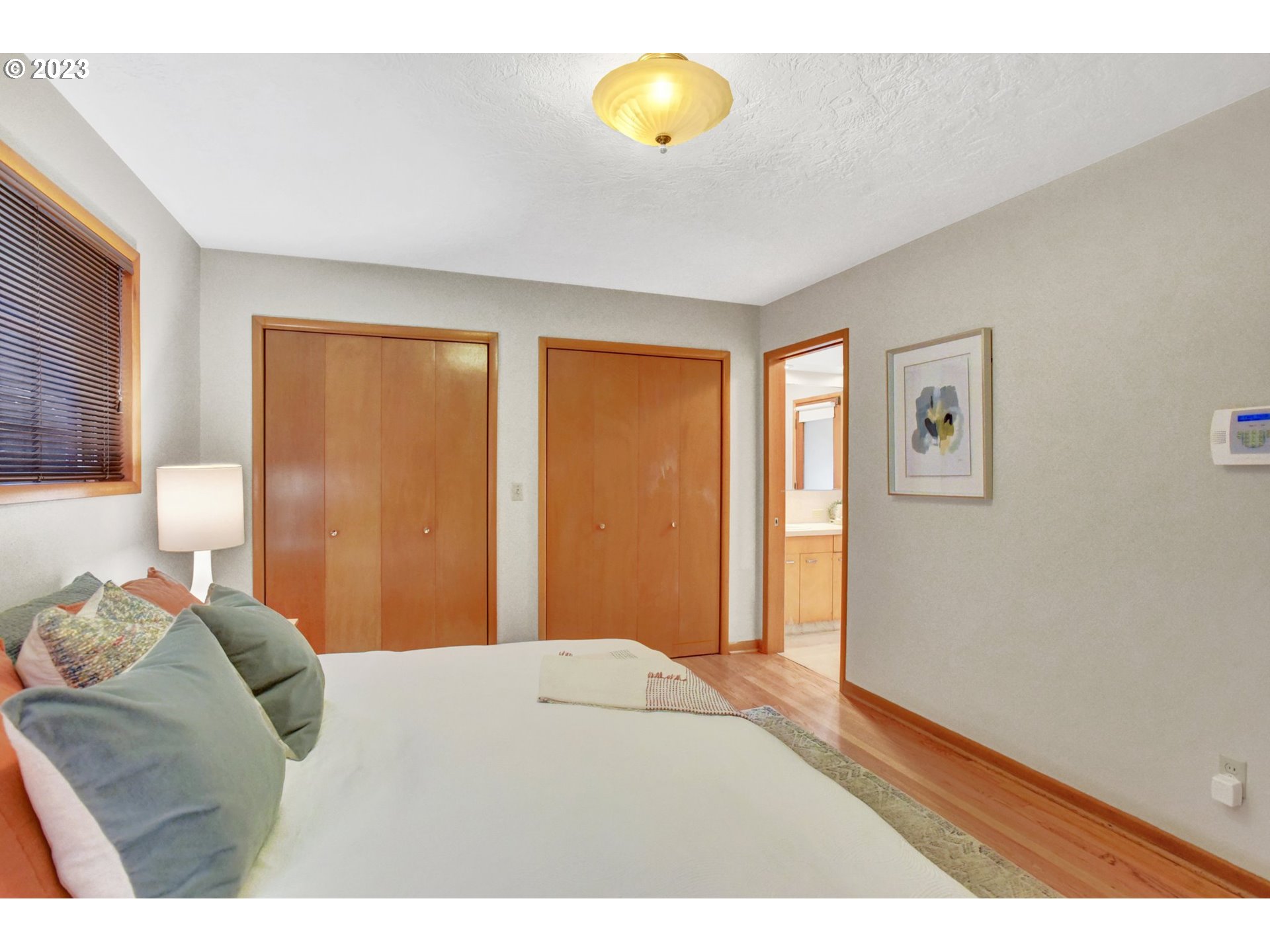 6309 Northeast Hancock Street Portland, OR 97213 - Photo 19 of 43 a bedroom with a bed and a window