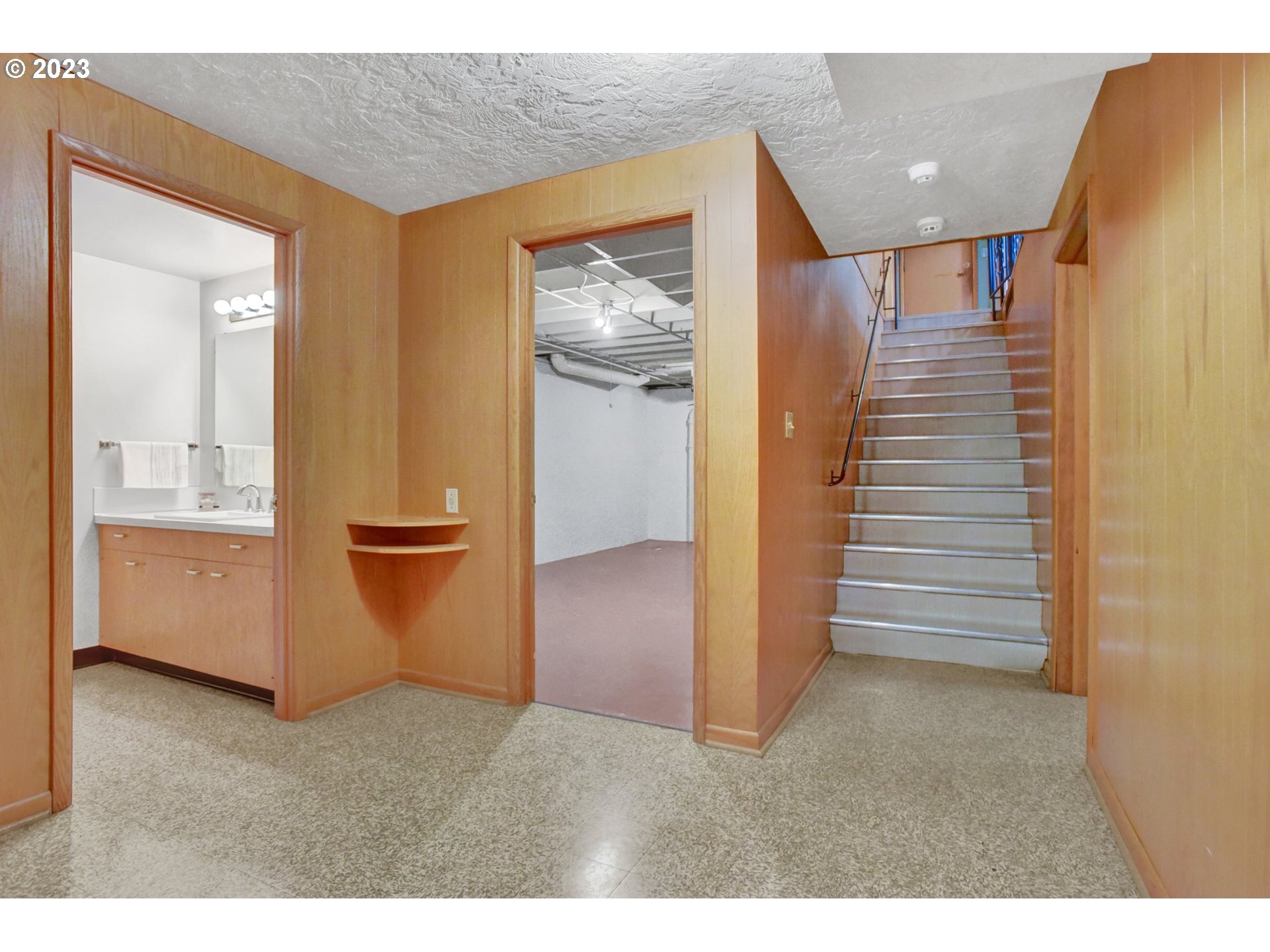 6309 Northeast Hancock Street Portland, OR 97213 - Photo 26 of 43 a view of a hallway with entryway and stairs