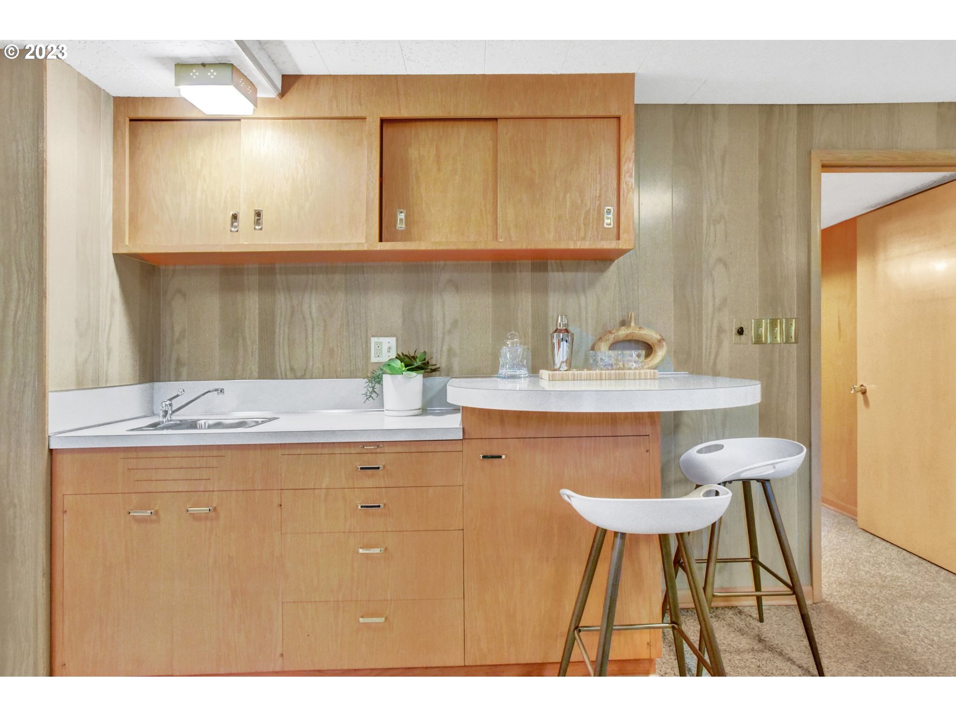 6309 Northeast Hancock Street Portland, OR 97213 - Photo 35 of 43 a kitchen with a sink and cabinets