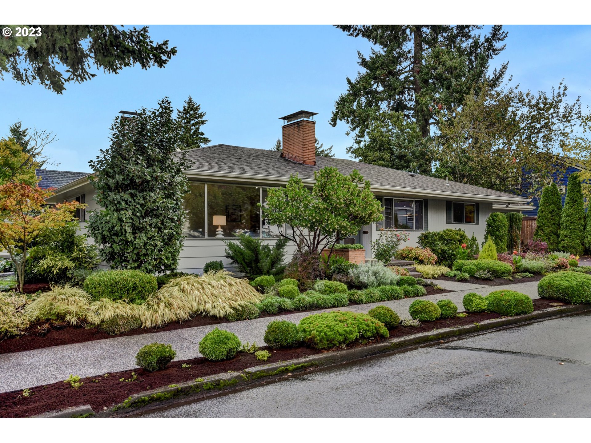 6309 Northeast Hancock Street Portland, OR 97213 - Photo 42 of 43 a front view of a house with a yard